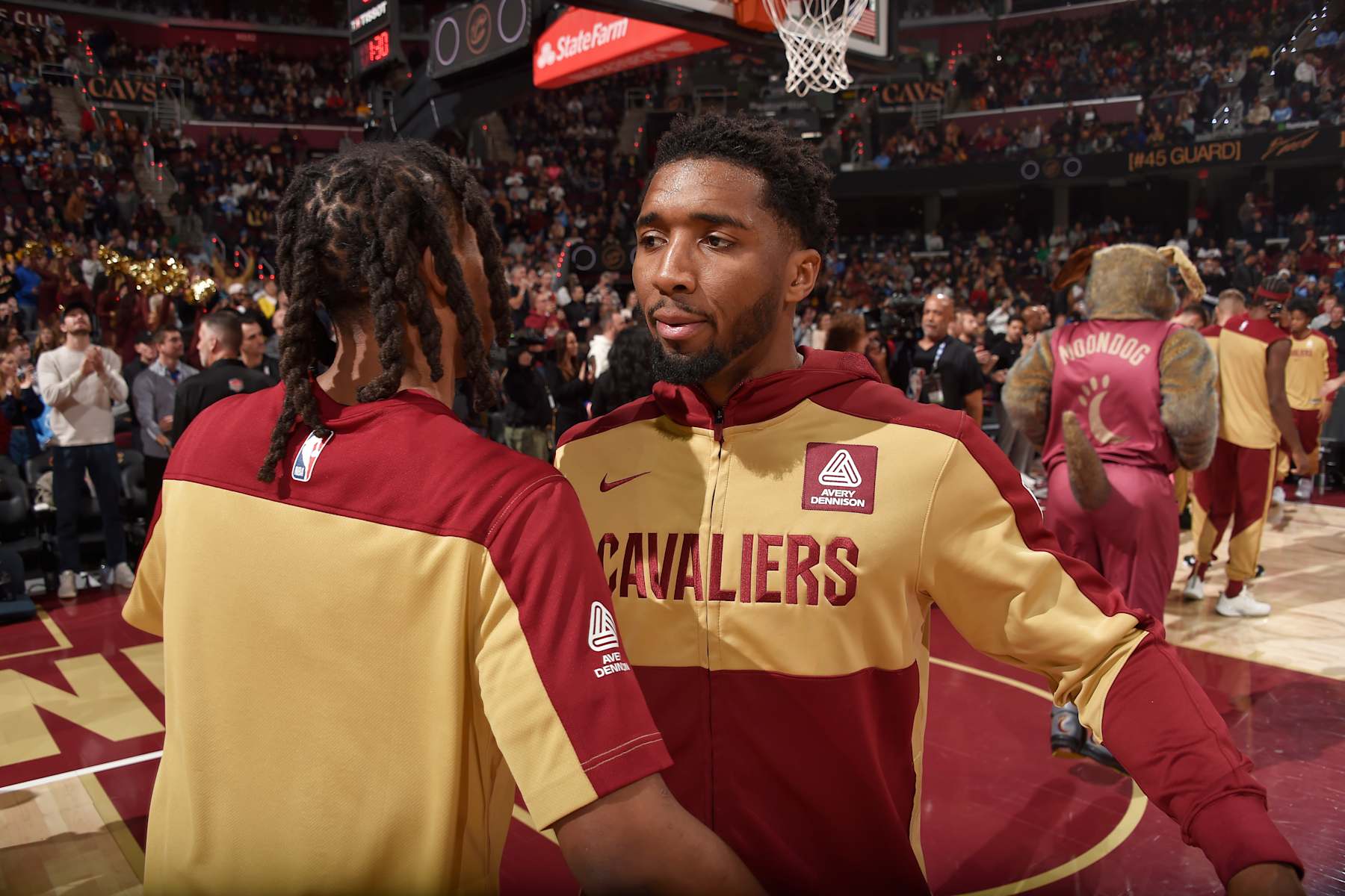 CLEVELAND, OH - DECEMBER 1: Donovan Mitchell #45 of the Cleveland Cavaliers embraces teammate before the game against the Boston Celtics on December 1, 2024 at Rocket Mortgage FieldHouse in Cleveland, Ohio. NOTE TO USER: User expressly acknowledges and agrees that, by downloading and/or using this Photograph, user is consenting to the terms and conditions of the Getty Images License Agreement. Mandatory Copyright Notice: Copyright 2024 NBAE (Photo by David Liam Kyle/NBAE via Getty Images)
