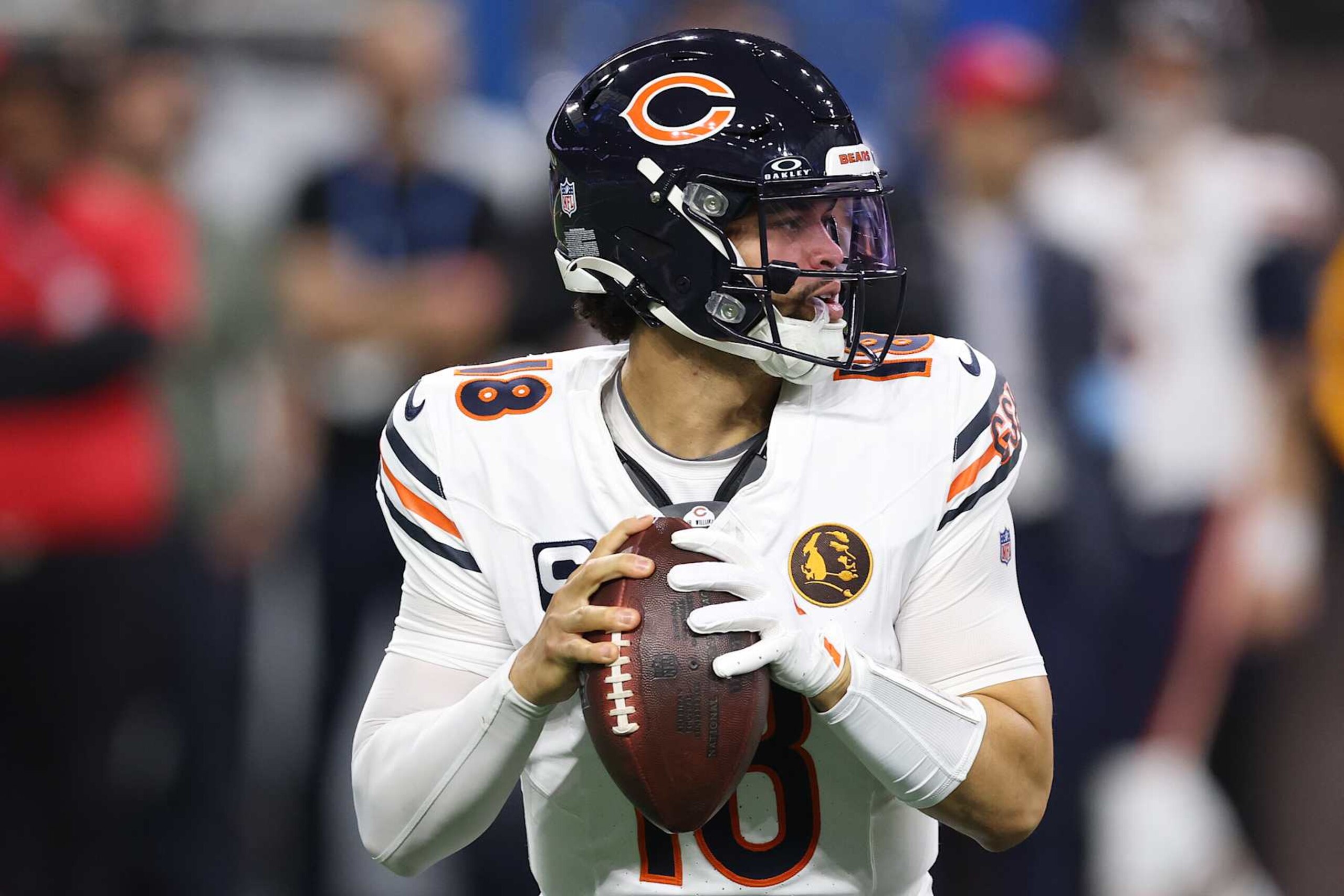 DETROIT, MICHIGAN - NOVEMBER 28: Quarterback Caleb Williams #18 of the Chicago Bears throws a pass during the second quarter against the Detroit Lions at Ford Field on November 28, 2024 in Detroit, Michigan. (Photo by Gregory Shamus/Getty Images)