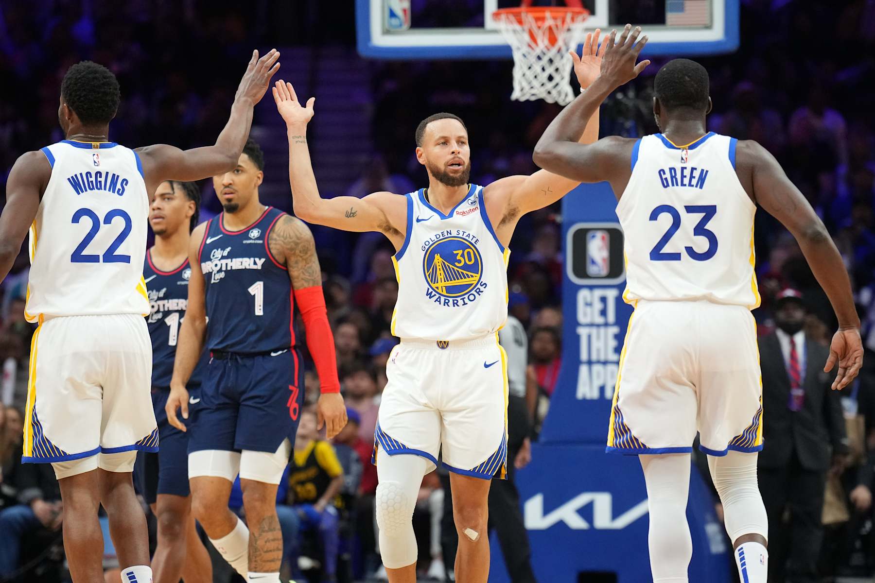 PHILADELPHIA, PA - FEBRUARY 7:  Andrew Wiggins #22 of the Golden State Warriors Draymond Green #23 of the Golden State Warriors & Stephen Curry #30 of the Golden State Warriors high five during the game on February 7, 2024 at the Wells Fargo Center in Philadelphia, Pennsylvania NOTE TO USER: User expressly acknowledges and agrees that, by downloading and/or using this Photograph, user is consenting to the terms and conditions of the Getty Images License Agreement. Mandatory Copyright Notice: Copyright 2024 NBAE (Photo by Jesse D. Garrabrant/NBAE via Getty Images)
