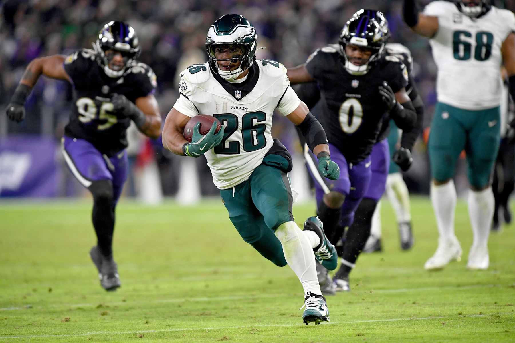 BALTIMORE, MD - DECEMBER 01: Eagles running back Saquon Barkley (26) runs for a 25-yard touchdown during the fourth quarter of the Philadelphia Eagles versus Baltimore Ravens NFL game at M&T Bank Stadium on December 1, 2024 in Baltimore, MD. (Photo by Randy Litzinger/Icon Sportswire via Getty Images)