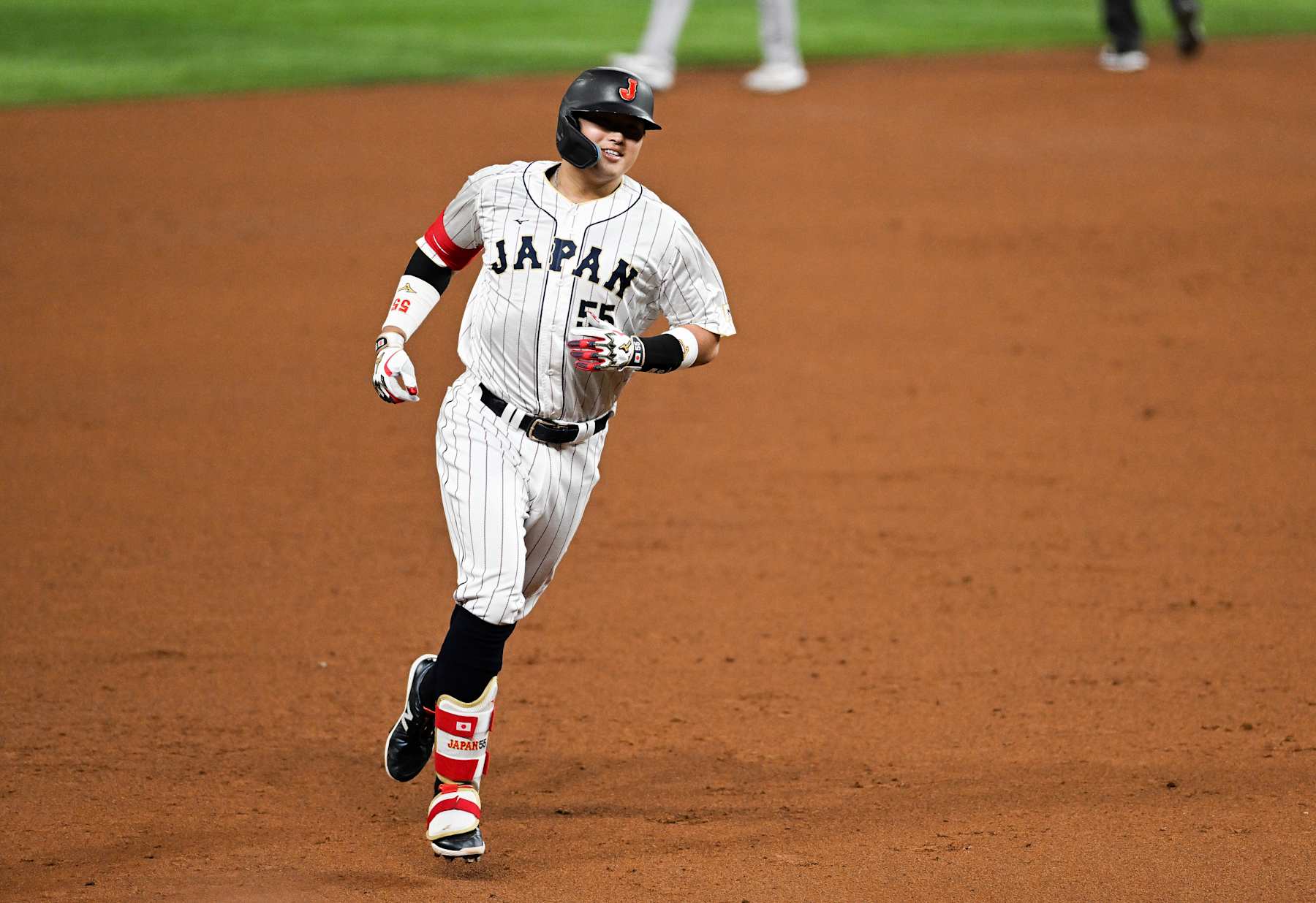 MIAMI, FLORIDA - MARCH 21: Munetaka Murakami #55 of Team Japan rounds the bases after hitting a solo home run in the bottom of the second inning during World Baseball Classic Championship between United States and Japan at loanDepot park on March 21, 2023 in Miami, Florida. (Photo by Gene Wang/Getty Images)