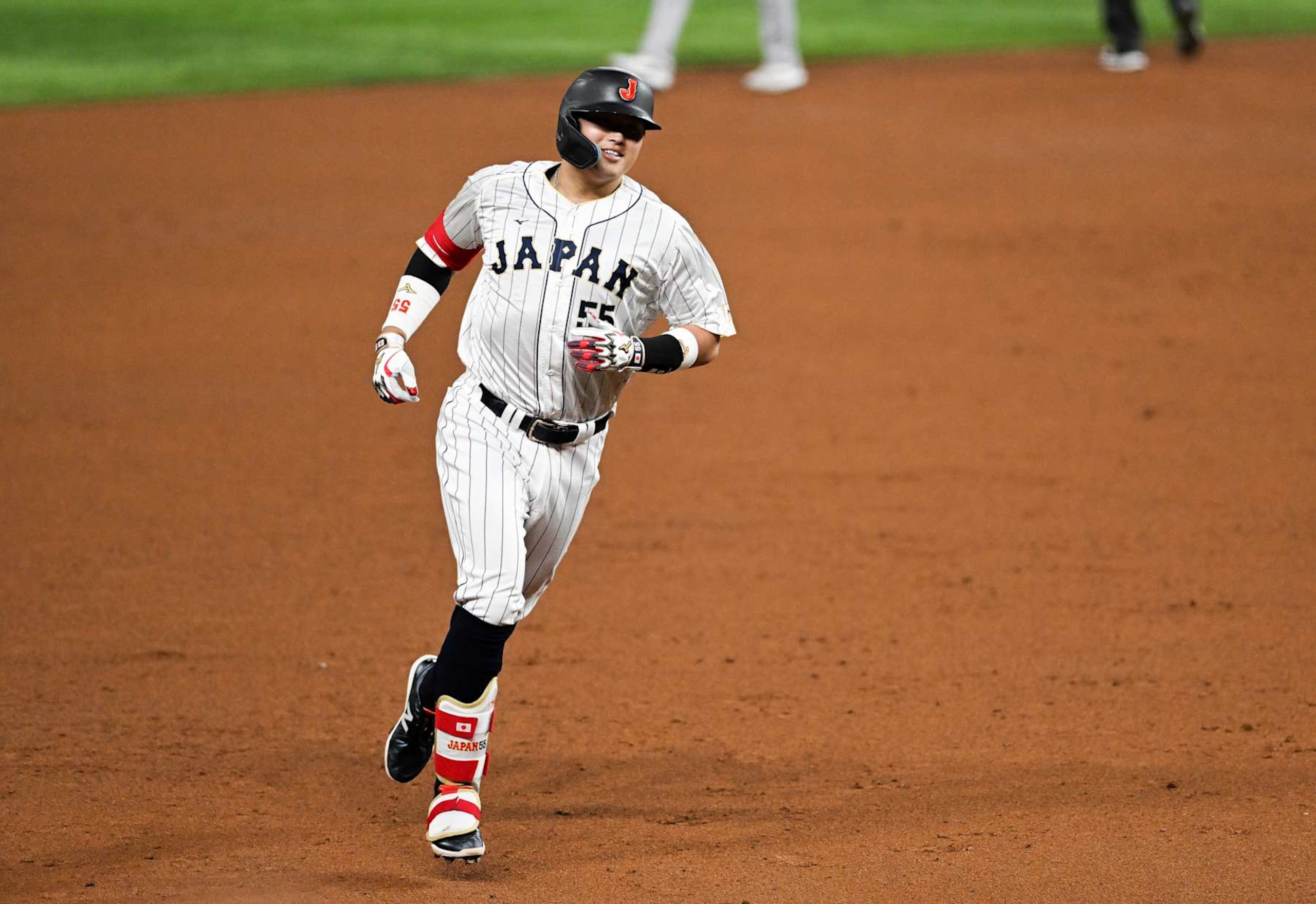 MIAMI, FLORIDA - MARCH 21: Munetaka Murakami #55 of Team Japan rounds the bases after hitting a solo home run in the bottom of the second inning during World Baseball Classic Championship between United States and Japan at loanDepot park on March 21, 2023 in Miami, Florida. (Photo by Gene Wang/Getty Images)