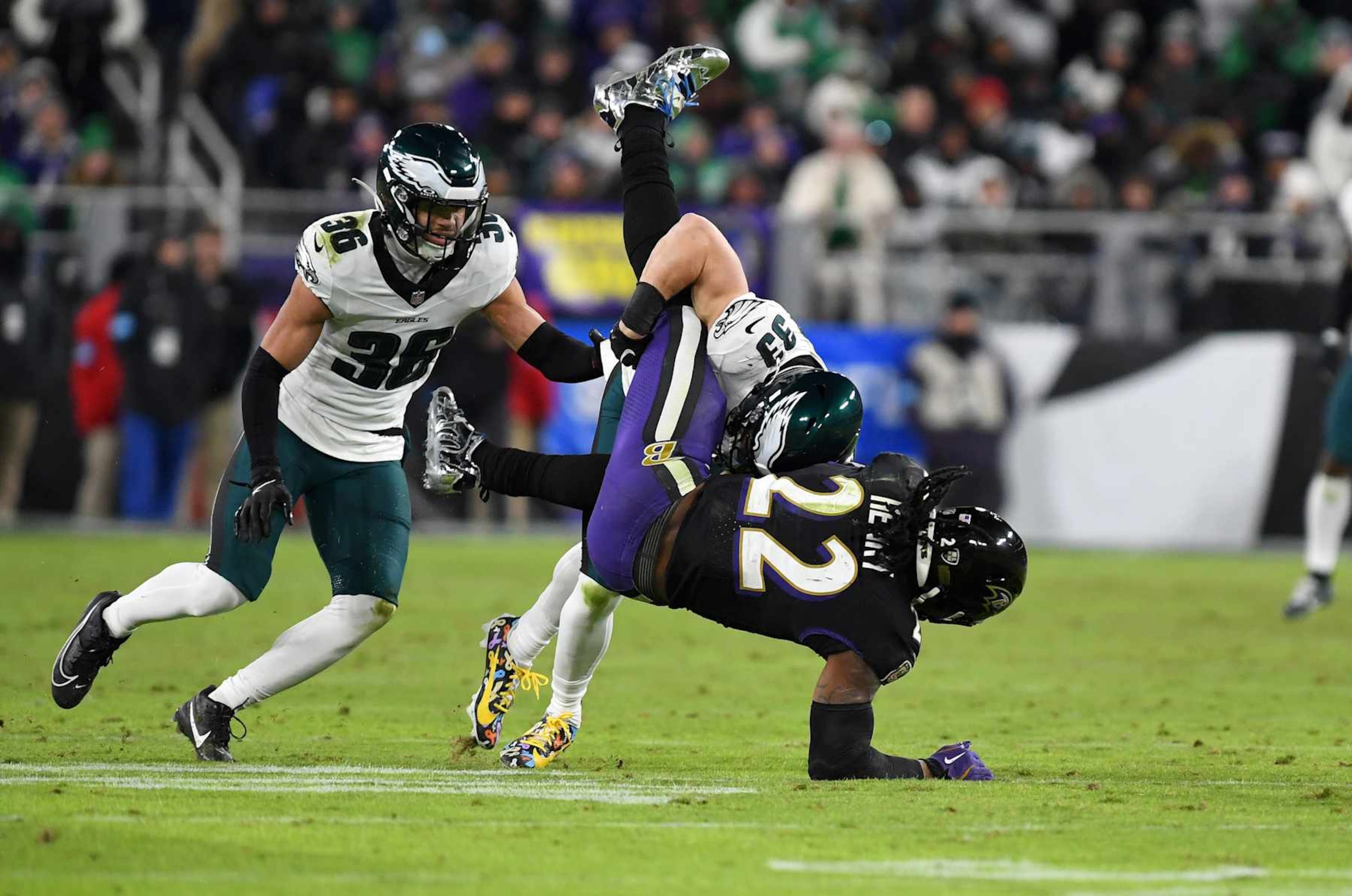 BALTIMORE, MD - DECEMBER 01: Eagles cornerback Cooper DeJean (33) tackles and slams Ravens running back Derrick Henry (22) to the ground after a pass in the flat during the Philadelphia Eagles versus Baltimore Ravens NFL game at M&T Bank Stadium on December 1, 2024 in Baltimore, MD. (Photo by Randy Litzinger/Icon Sportswire via Getty Images)