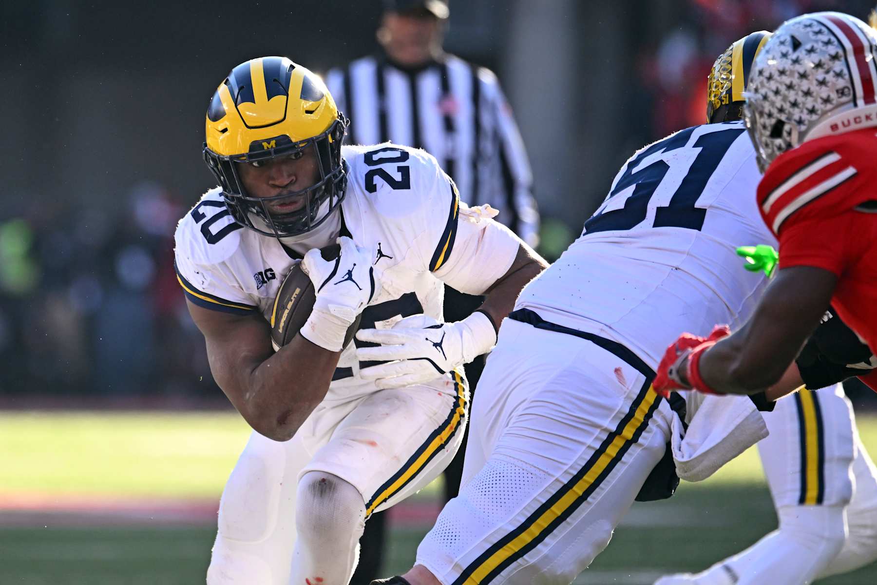 COLUMBUS, OHIO - NOVEMBER 30: Kalel Mullings #20 of the Michigan Wolverines runs with the ball during the fourth quarter of a game against the Ohio State Buckeyes at Ohio Stadium on November 30, 2024 in Columbus, Ohio. (Photo by Ben Jackson/Getty Images)