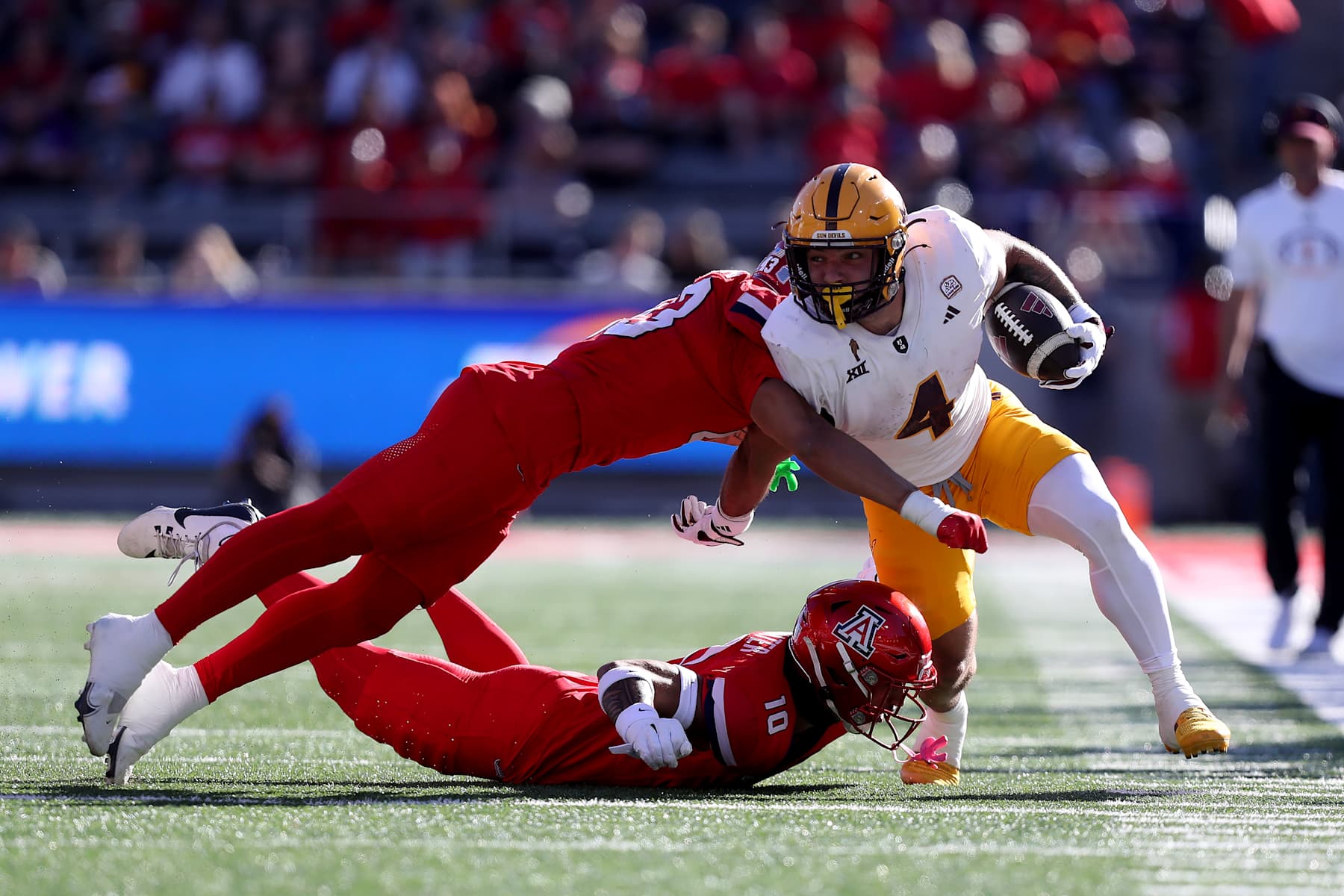 TUCSON, AZ - NOVEMBER 30: Arizona State Sun Devils running back Cam Skattebo #4 during the first half of a football game between the Arizona State University Sun Devils and the University of Arizona Wildcats.  November 30, 2024 at Arizona Stadium in Tucson, AZ. (Photo by Christopher Hook/Icon Sportswire via Getty Images)