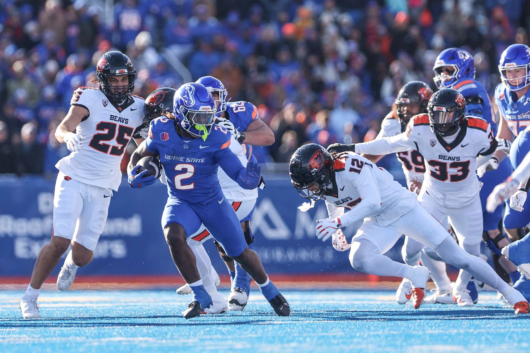 BOISE, ID - NOVEMBER 29: Running back Ashton Jeanty #2 of the Boise State Broncos looks to run past the tackle attempt of defensive back Tyrice Ivy Jr. #12 of the Oregon State Beavers during the first half at Albertsons Stadium on November 29, 2024 in Boise, Idaho. (Photo by Loren Orr/Getty Images)