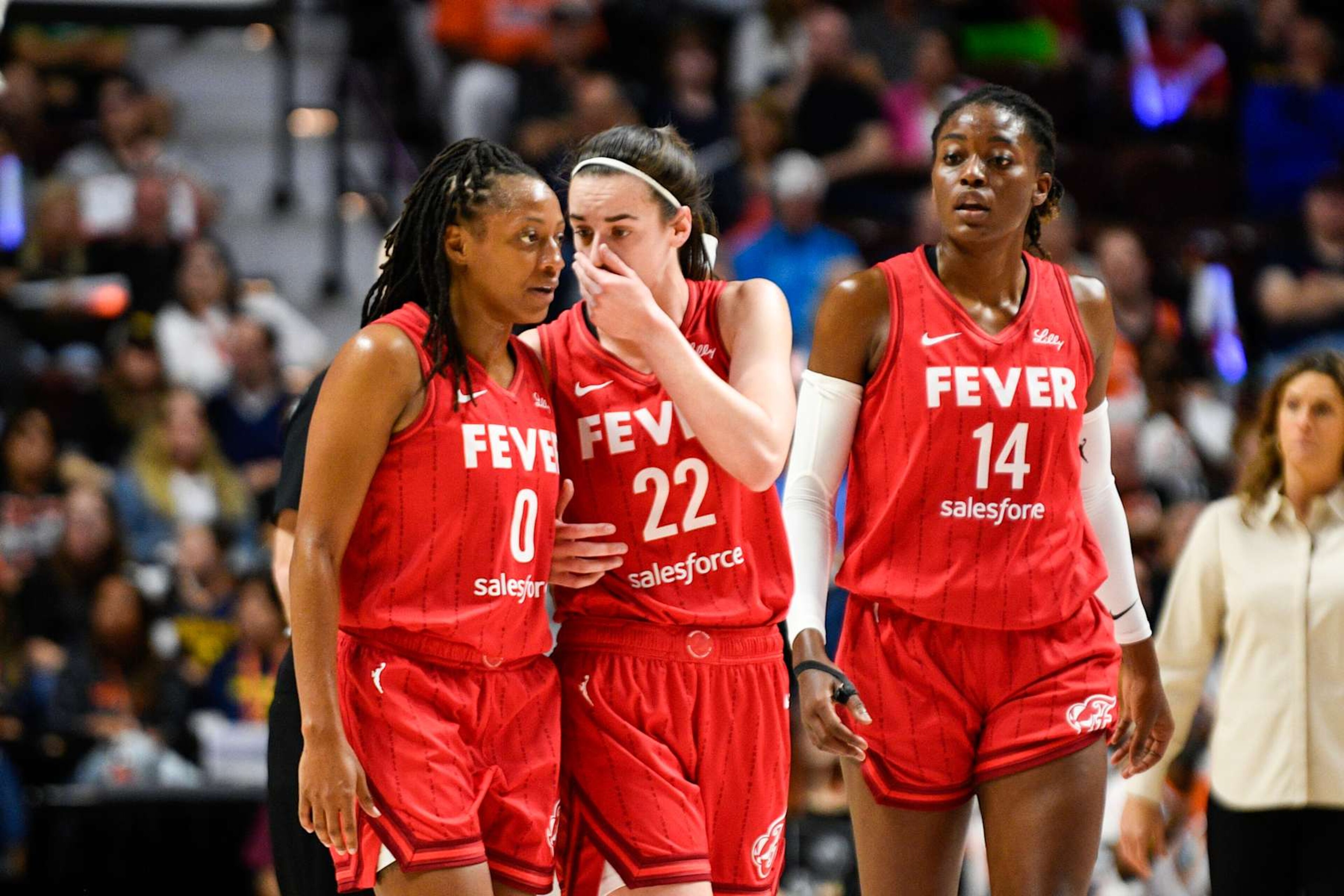 UNCASVILLE, CT - SEPTEMBER 25: Indiana Fever guard Caitlin Clark (22) speaks with Indiana Fever guard Kelsey Mitchell (0) during Game 2 of the first round of the WNBA Playoffs between the Indiana Fever and the Connecticut Sun on September 25, 2024, at Mohegan Sun Arena in Uncasville, CT. (Photo by Erica Denhoff/Icon Sportswire via Getty Images) UNCASVILLE, CT - SEPTEMBER 25: Indiana Fever guard Caitlin Clark (22) speaks with Indiana Fever guard Kelsey Mitchell (0) during Game 2 of the first round of the WNBA Playoffs between the Indiana Fever and the Connecticut Sun on September 25, 2024, at Mohegan Sun Arena in Uncasville, CT. (Photo by Erica Denhoff/Icon Sportswire via Getty Images)