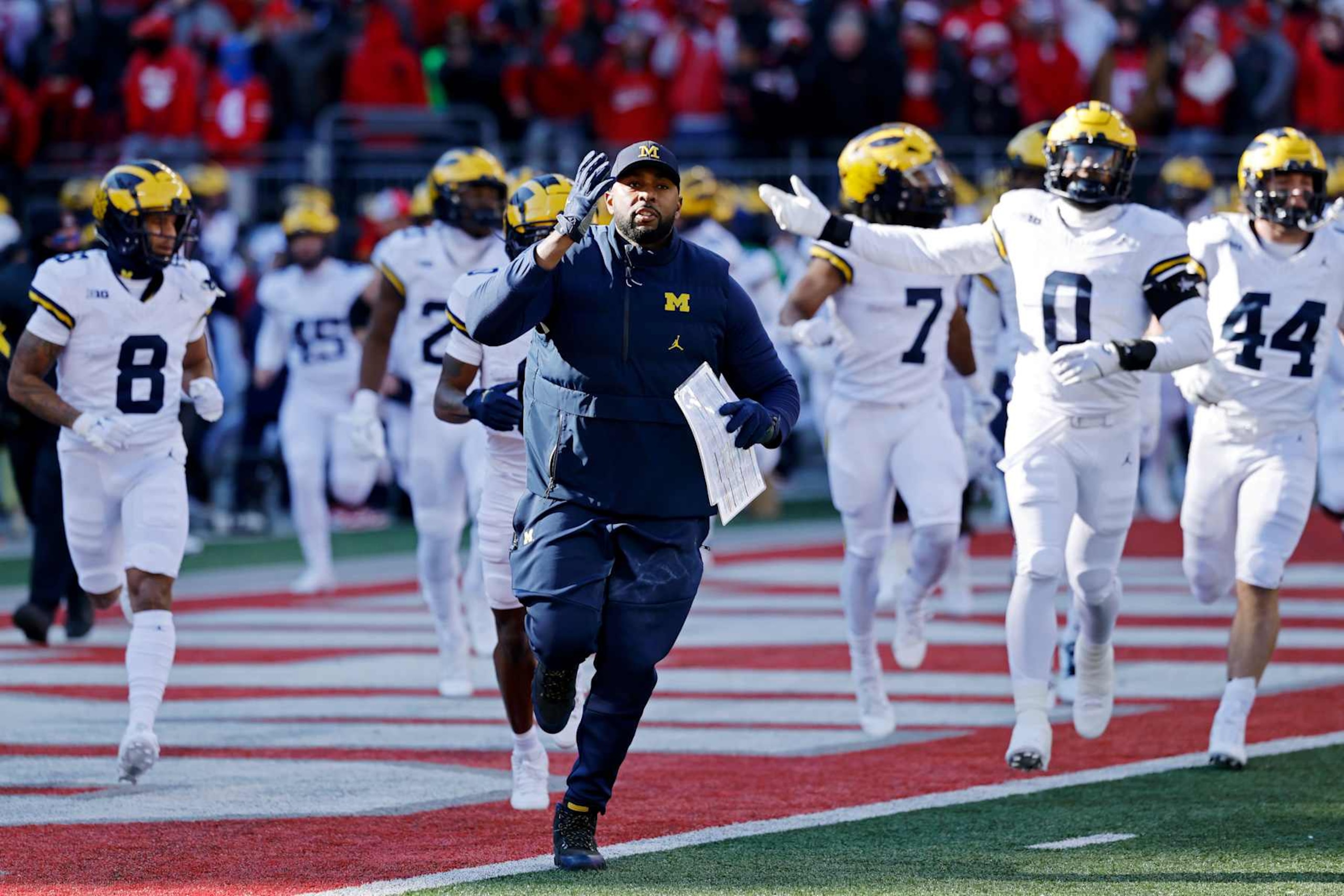 COLUMBUS, OH - NOVEMBER 30: Michigan Wolverines head coach Sherrone Moore leads his team to the field before a college football game against the Ohio State Buckeyes on November 30, 2024 at Ohio Stadium in Columbus, Ohio. (Photo by Joe Robbins/Icon Sportswire via Getty Images)