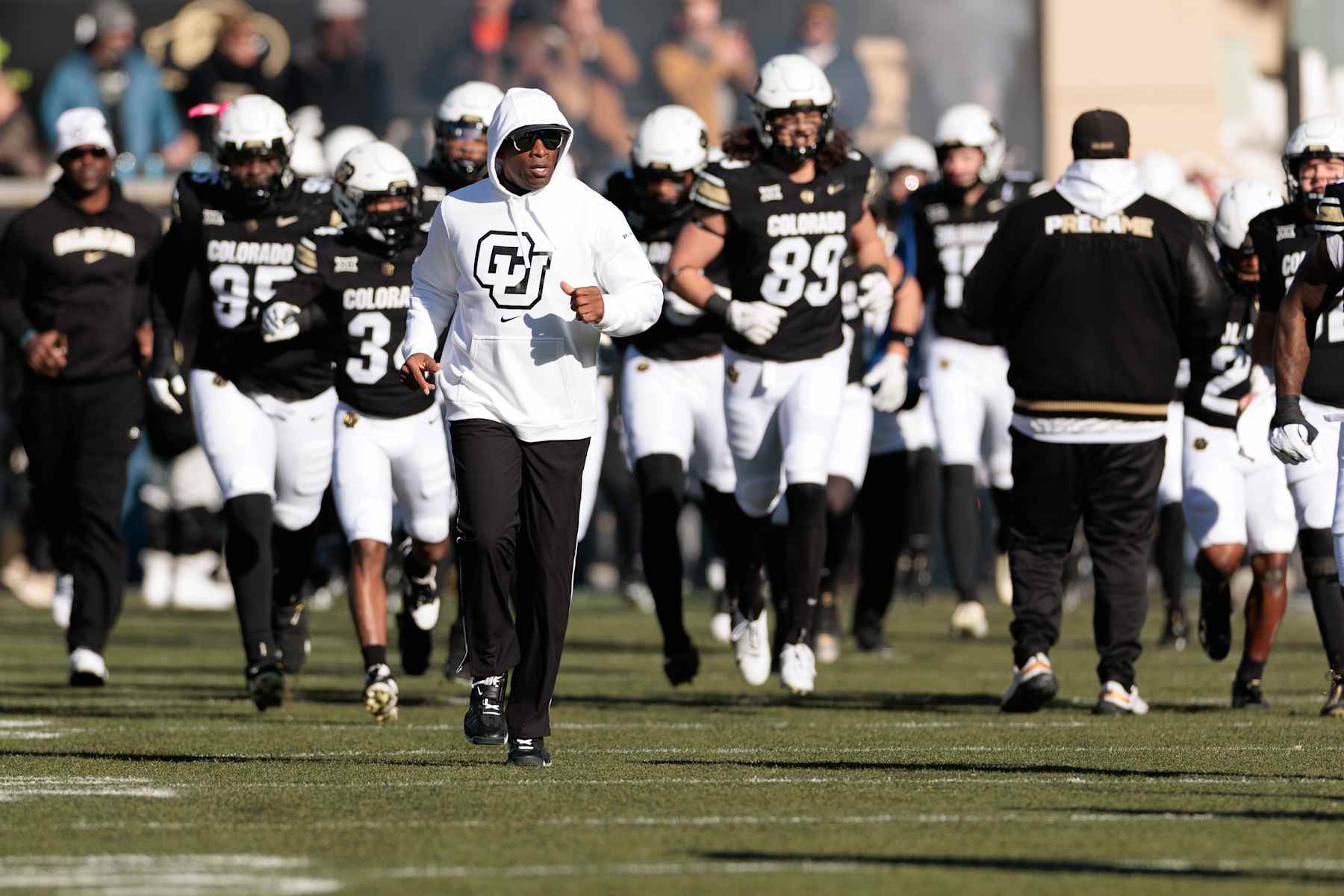 BOULDER, COLORADO - NOVEMBER 29: Head coach Deion Sanders of the Colorado Buffaloes runs out with his team prior to the game against the Oklahoma State Cowboys at Folsom Field on November 29, 2024 in Boulder, Colorado. (Photo by Andrew Wevers/Getty Images) BOULDER, COLORADO - NOVEMBER 29: Head coach Deion Sanders of the Colorado Buffaloes runs out with his team prior to the game against the Oklahoma State Cowboys at Folsom Field on November 29, 2024 in Boulder, Colorado. (Photo by Andrew Wevers/Getty Images)