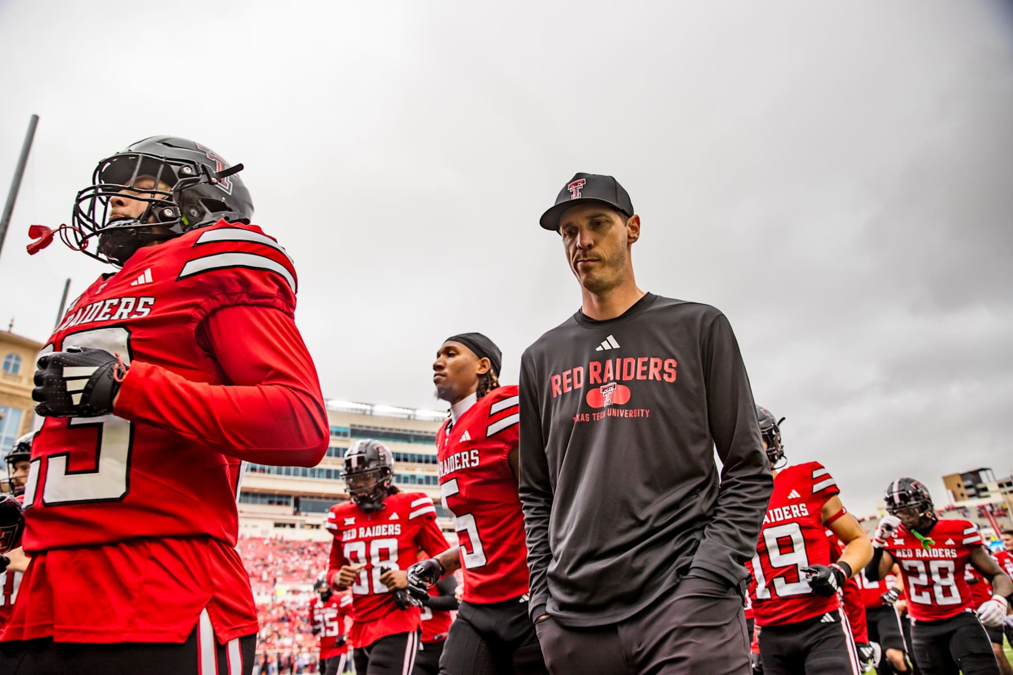 LUBBOCK, TEXAS - OCTOBER 19: Offensive coordinator Zach Kittley of the Texas Tech Red Raiders walks off the field before the game against the Baylor Bears at Jones AT&T Stadium on October 19, 2024 in Lubbock, Texas. (Photo by John E. Moore III/Getty Images) LUBBOCK, TEXAS - OCTOBER 19: Offensive coordinator Zach Kittley of the Texas Tech Red Raiders walks off the field before the game against the Baylor Bears at Jones AT&T Stadium on October 19, 2024 in Lubbock, Texas. (Photo by John E. Moore III/Getty Images)