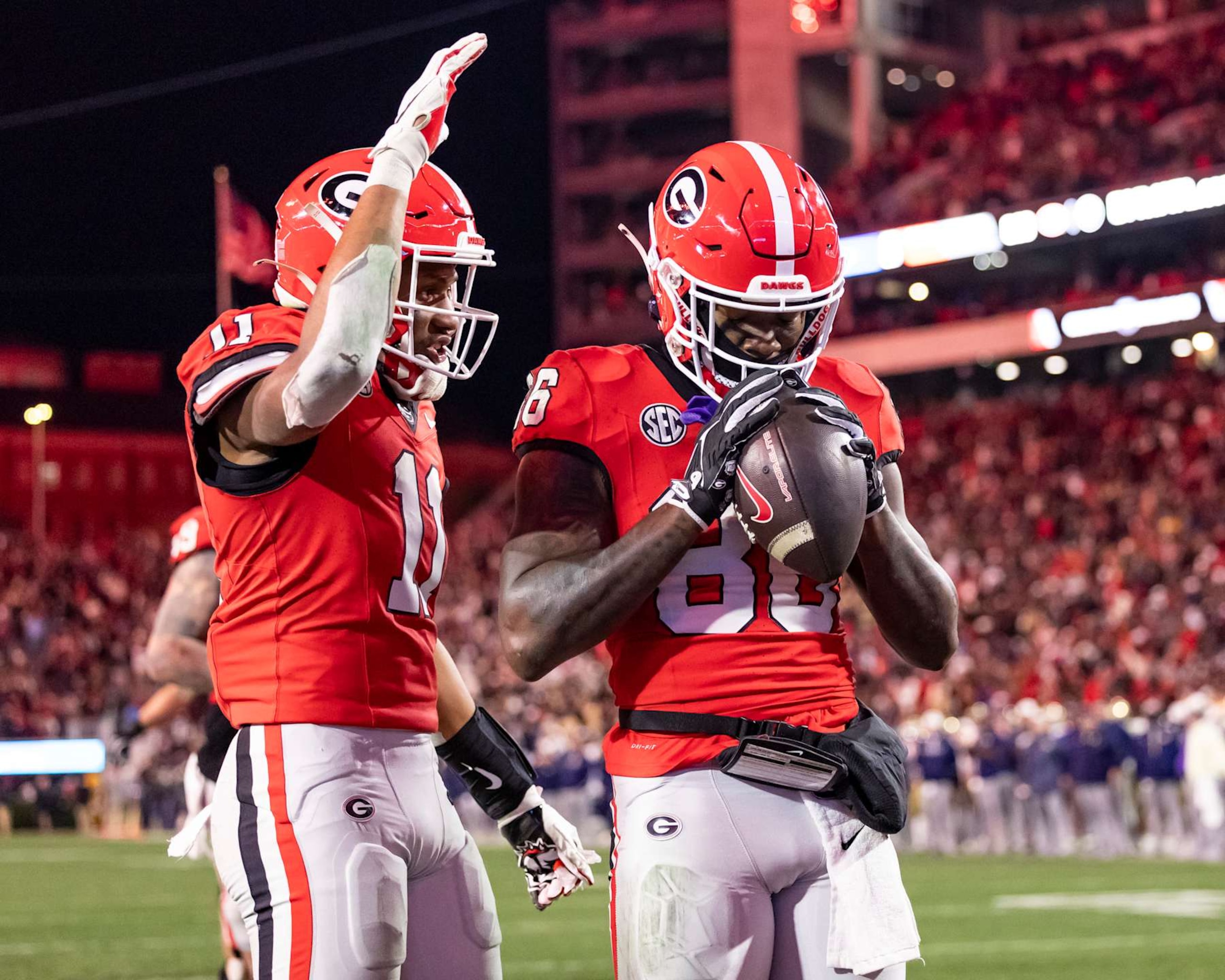 ATHENS, GEORGIA - NOVEMBER 29: Dillon Bell #86 is congratulated by Arian Smith #11 of the Georgia Bulldogs in overtime during a game between the Georgia Tech Yellow Jackets and the Georgia Bulldogs at Sanford Stadium on November 29, 2024 in Athens, Georgia.  (Photo by Steve Limentani/ISI Photos/Getty Images)