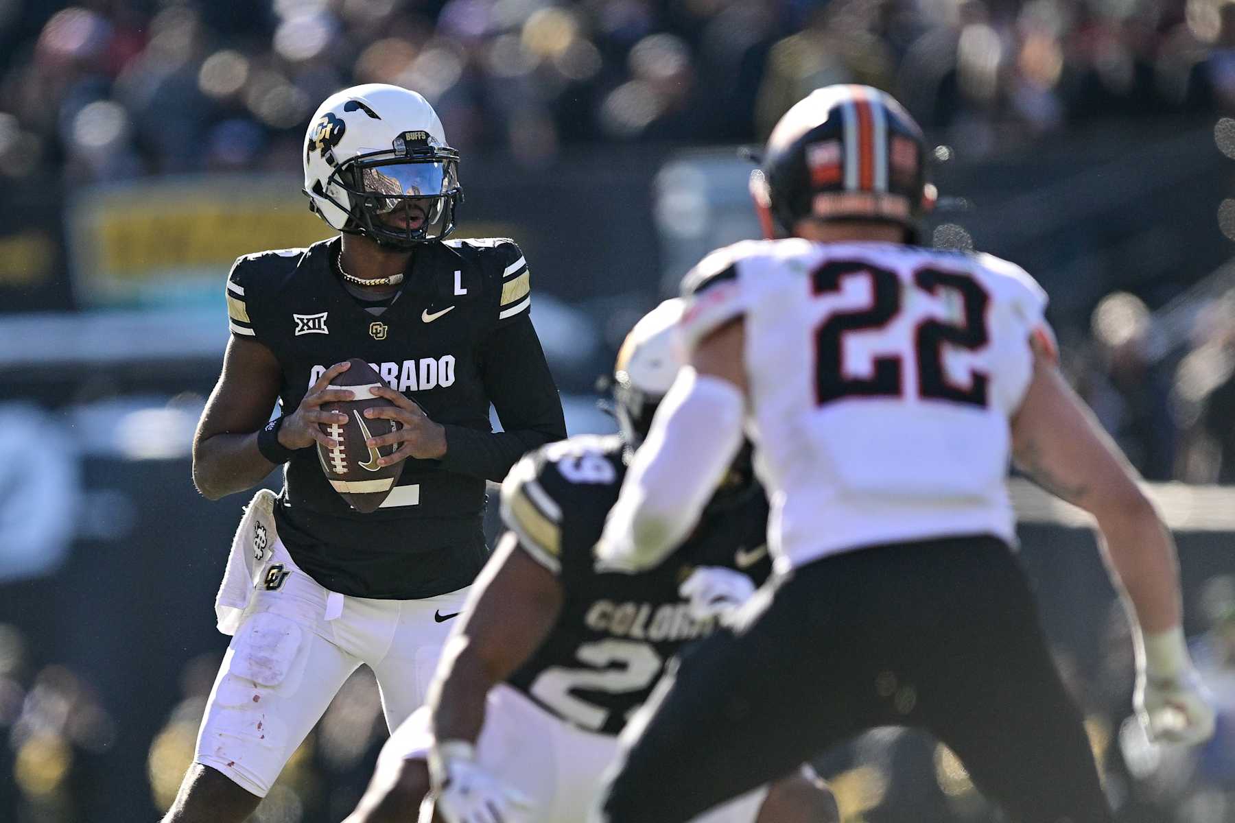 BOULDER, CO - NOVEMBER 29:  Shedeur Sanders #2 of the Colorado Buffaloes looks to pass against the Oklahoma State Cowboys in the third quarter at Folsom Field on November 29, 2024 in Boulder, Colorado. (Photo by Dustin Bradford/Getty Images)
