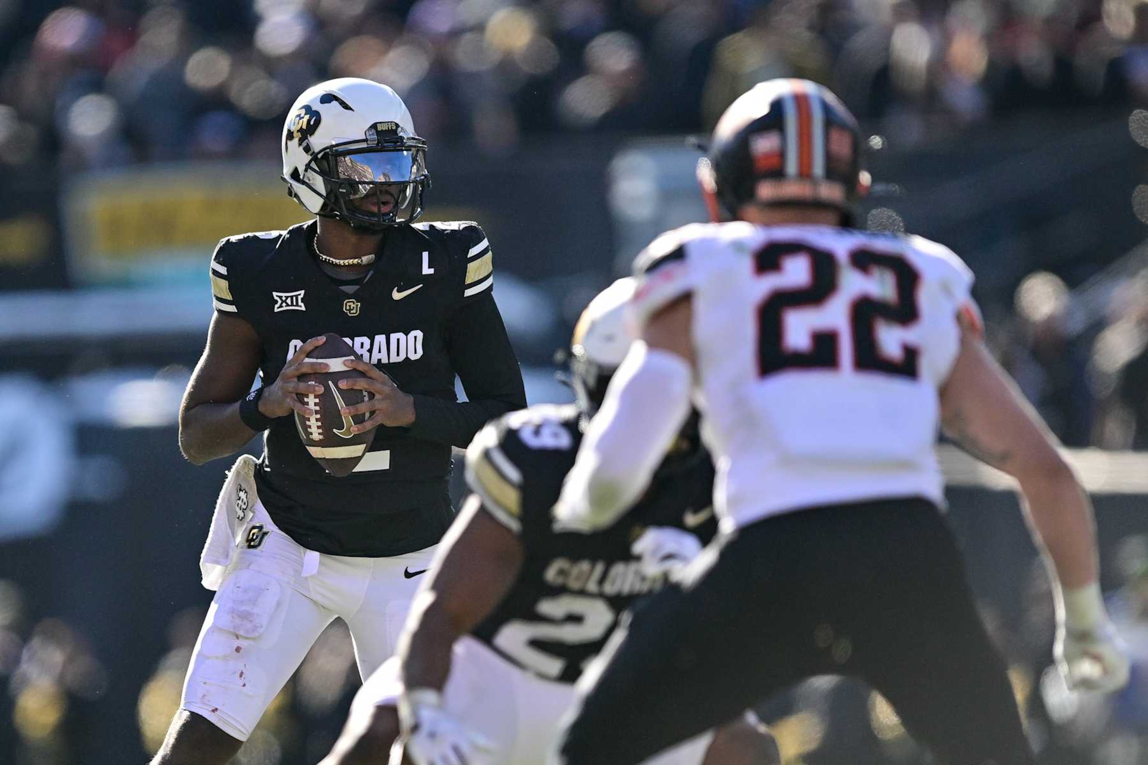 BOULDER, CO - NOVEMBER 29:  Shedeur Sanders #2 of the Colorado Buffaloes looks to pass against the Oklahoma State Cowboys in the third quarter at Folsom Field on November 29, 2024 in Boulder, Colorado. (Photo by Dustin Bradford/Getty Images)