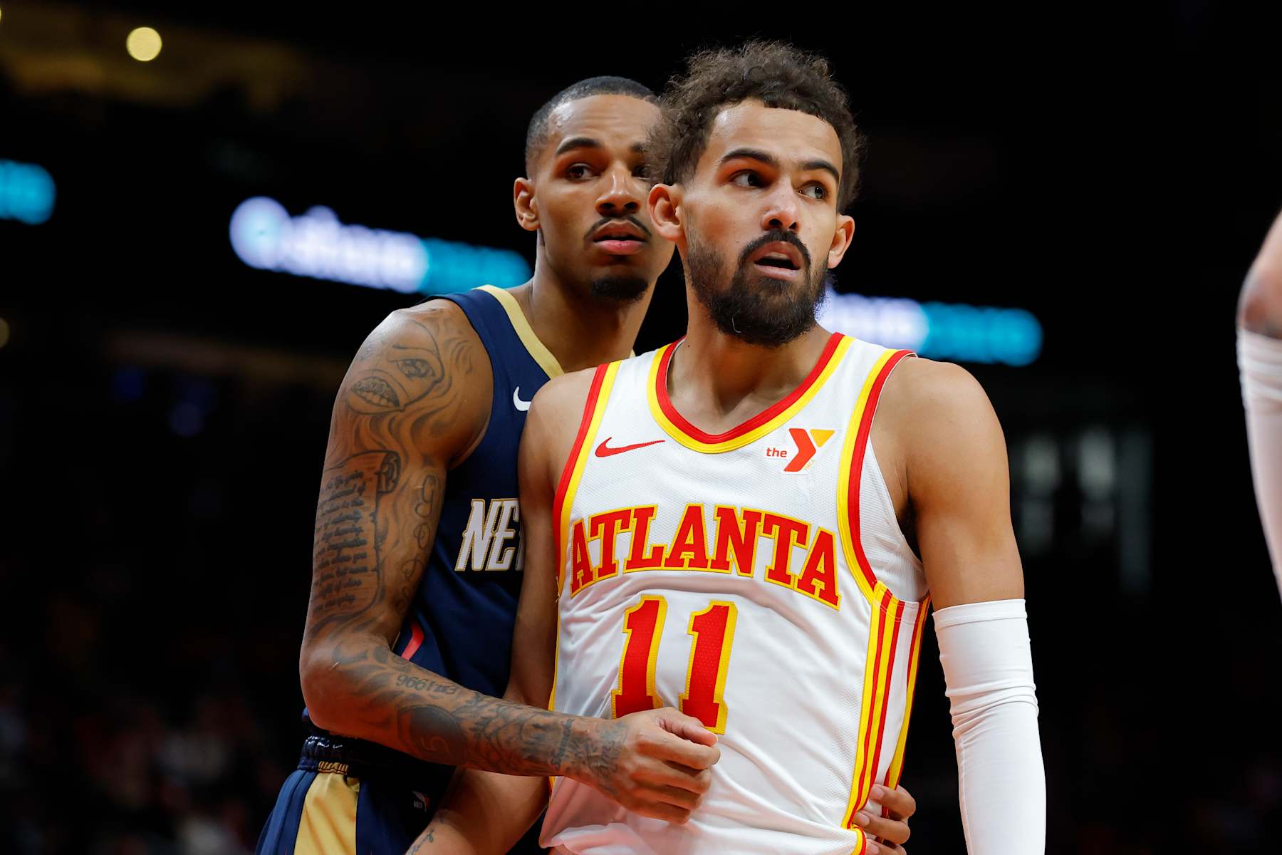 ATLANTA, GEORGIA - DECEMBER 2: Dejounte Murray #5 of the New Orleans Pelicans guards Trae Young #11 of the Atlanta Hawks during the second quarter at State Farm Arena on December 2, 2024 in Atlanta, Georgia. NOTE TO USER: User expressly acknowledges and agrees that, by downloading and or using this photograph, User is consenting to the terms and conditions of the Getty Images License Agreement. (Photo by Todd Kirkland/Getty Images)