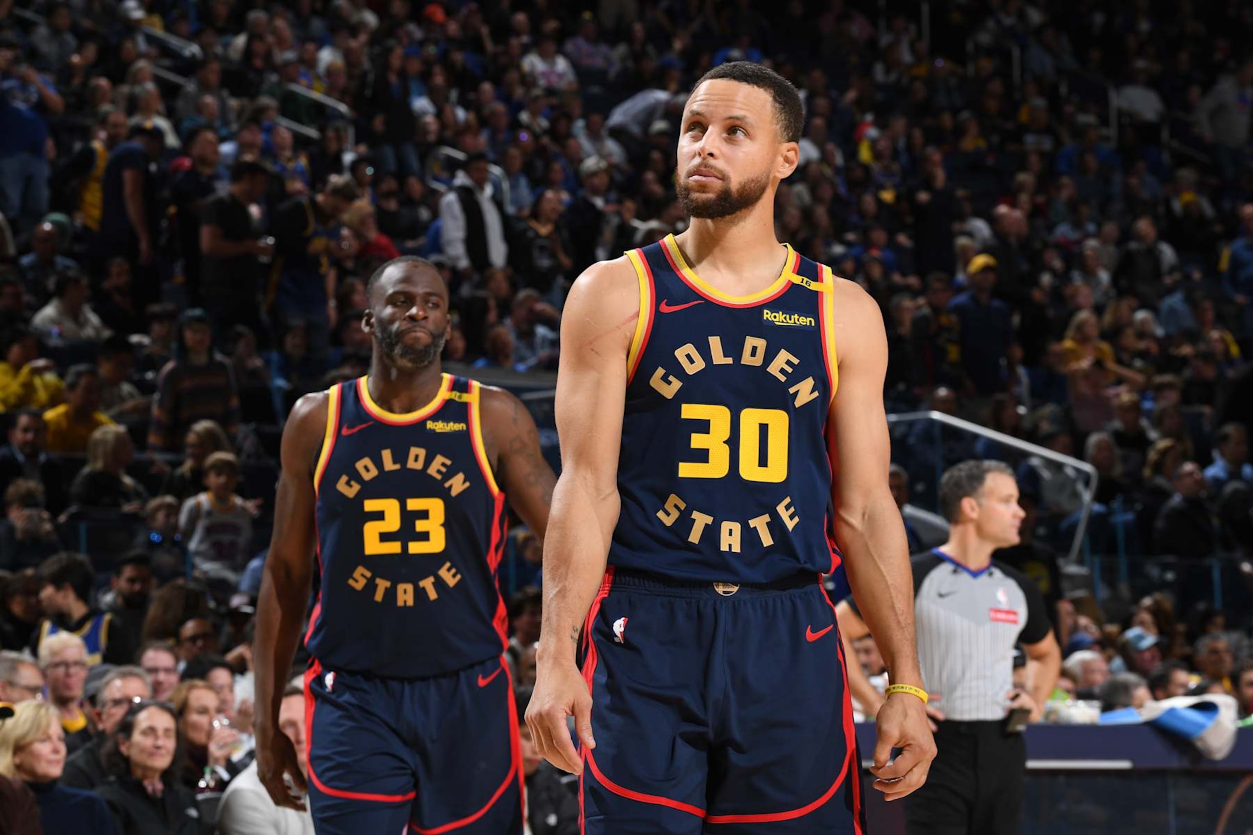 SAN FRANCISCO, CA - NOVEMBER 25: Draymond Green #23 and Stephen Curry #30 of the Golden State Warriors look on during the game against the Brooklyn Nets on November 25, 2024 at Chase Center in San Francisco, California. NOTE TO USER: User expressly acknowledges and agrees that, by downloading and or using this photograph, user is consenting to the terms and conditions of Getty Images License Agreement. Mandatory Copyright Notice: Copyright 2024 NBAE (Photo by Noah Graham/NBAE via Getty Images)