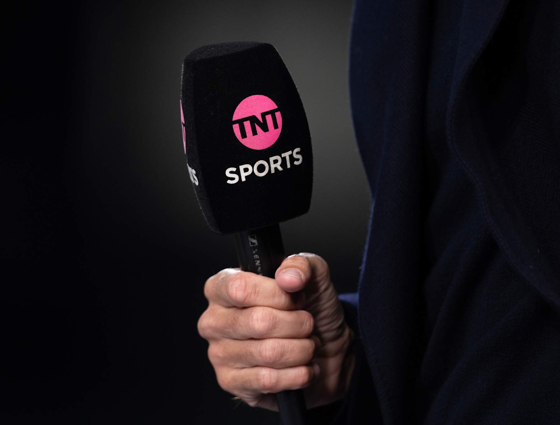BURNLEY, ENGLAND - SEPTEMBER 23: The TNT Sports logo on a micorphone held by a TV pundit ahead of the Premier League match between Burnley FC and Manchester United at Turf Moor on September 23, 2023 in Burnley, England. (Photo by Joe Prior/Visionhaus via Getty Images)