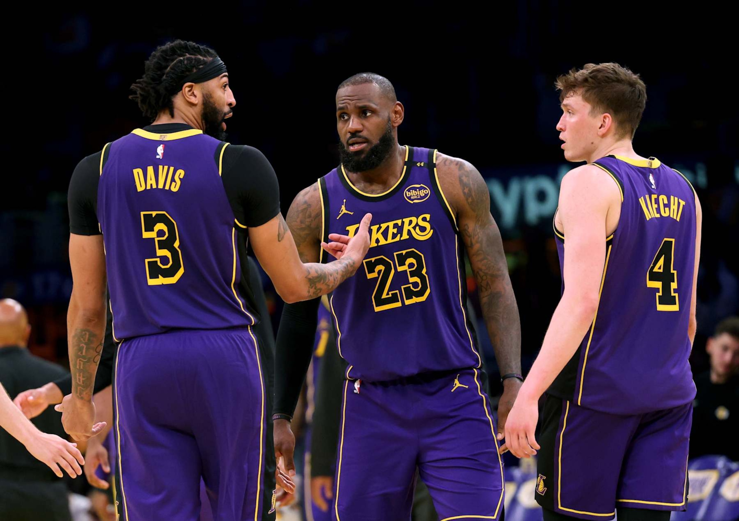 LOS ANGELES, CALIFORNIA - NOVEMBER 19: Anthony Davis #3 and LeBron James #23 of the Los Angeles Lakers react to Dalton Knecht #4, who shot nine three pointers and scored 37 points, during a 124-118 win over the Utah Jazz at Crypto.com Arena on November 19, 2024 in Los Angeles, California. (Photo by Harry How/Getty Images) NOTE TO USER: User expressly acknowledges and agrees that, by downloading and or using this photograph, User is consenting to the terms and conditions of the Getty Images License Agreement.  (Photo by Harry How/Getty Images)