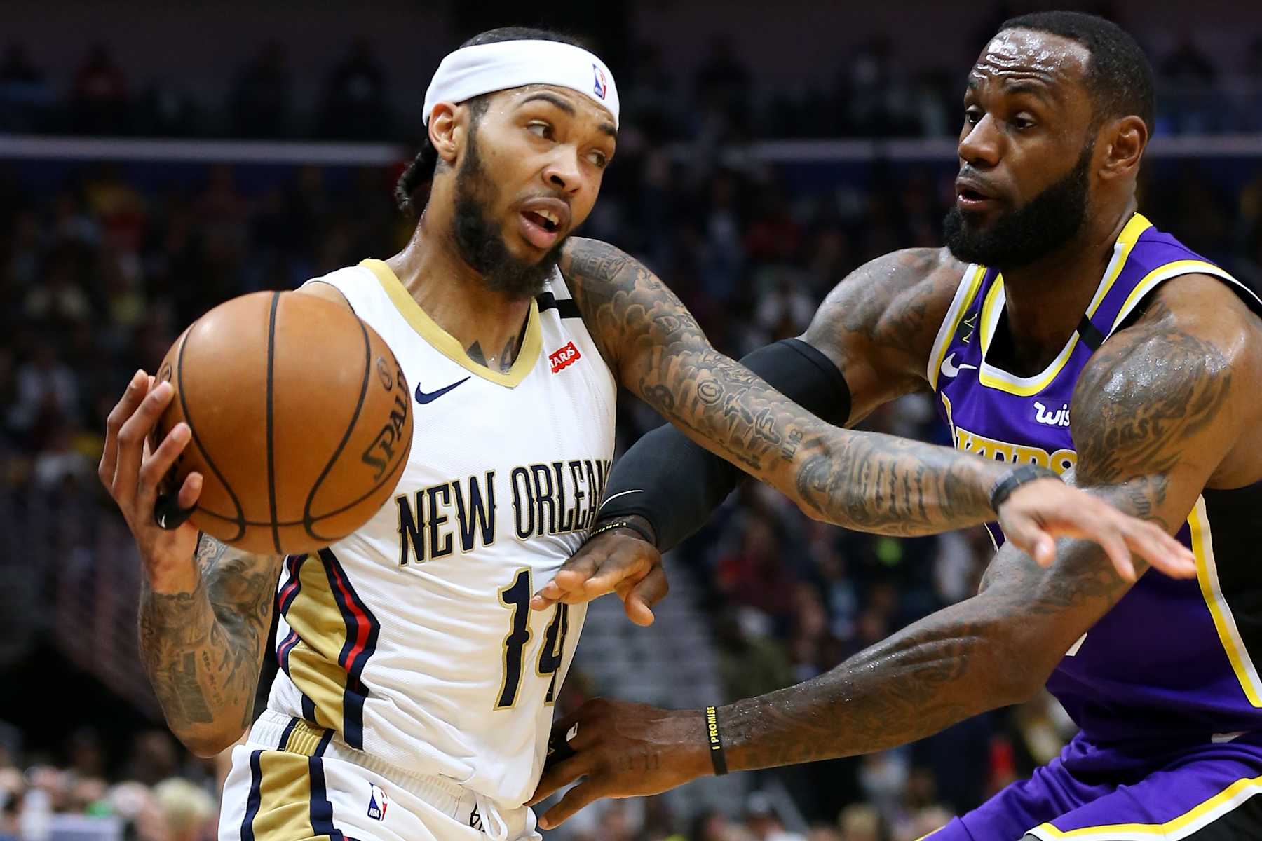 NEW ORLEANS, LOUISIANA - MARCH 01: Brandon Ingram #14 of the New Orleans Pelicans drives against LeBron James #23 of the Los Angeles Lakers during the first half at the Smoothie King Center on March 01, 2020 in New Orleans, Louisiana. NOTE TO USER: User expressly acknowledges and agrees that, by downloading and or using this Photograph, user is consenting to the terms and conditions of the Getty Images License Agreement. (Photo by Jonathan Bachman/Getty Images)