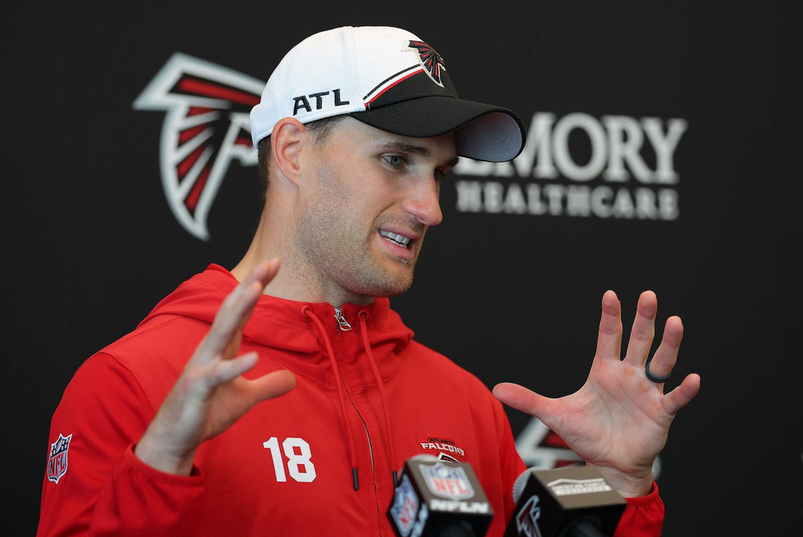 FLOWERY BRANCH, GEORGIA - MAY 14:  Quarterback Kirk Cousins #18 of the Atlanta Falcons speaks to the media during OTA offseason workouts at the Atlanta Falcons training facility on May 14, 2024 in Flowery Branch, Georgia. (Photo by Kevin C. Cox/Getty Images)