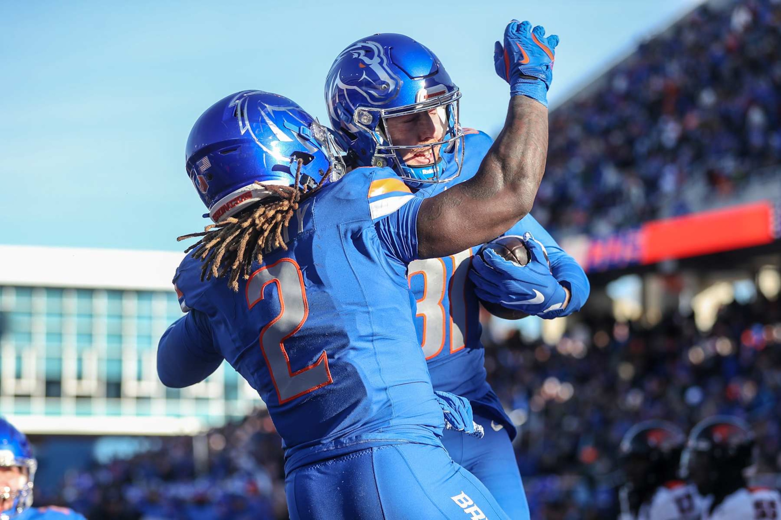 BOISE, ID - NOVEMBER 29: Wide receiver Austin Bolt #81 and running back Ashton Jeanty #2 of the Boise State Broncos celebrate a touchdown during the first half against the Oregon State Beavers at Albertsons Stadium on November 29, 2024 in Boise, Idaho. (Photo by Loren Orr/Getty Images)