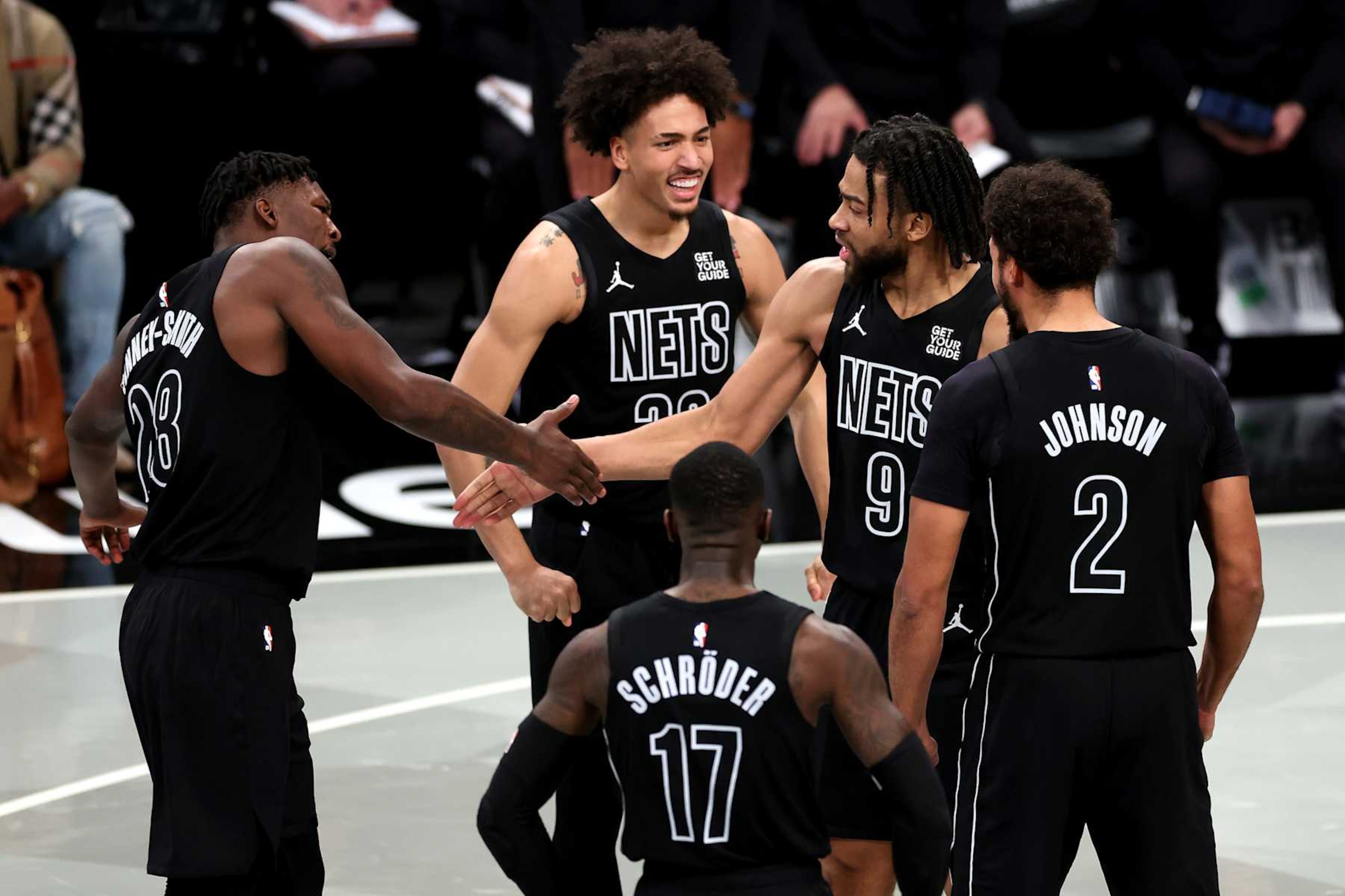 NEW YORK, NEW YORK - NOVEMBER 19: Trendon Watford #9, Dorian Finney-Smith #28, Dennis Schroder #17, Jalen Wilson #22, and Cameron Johnson #2 of the Brooklyn Nets celebrate against the Charlotte Hornets at Barclays Center on November 19, 2024 in the Brooklyn borough of New York City. NOTE TO USER: User expressly acknowledges and agrees that, by downloading and or using this photograph, User is consenting to the terms and conditions of the Getty Images License Agreement.  (Photo by Luke Hales/Getty Images)
