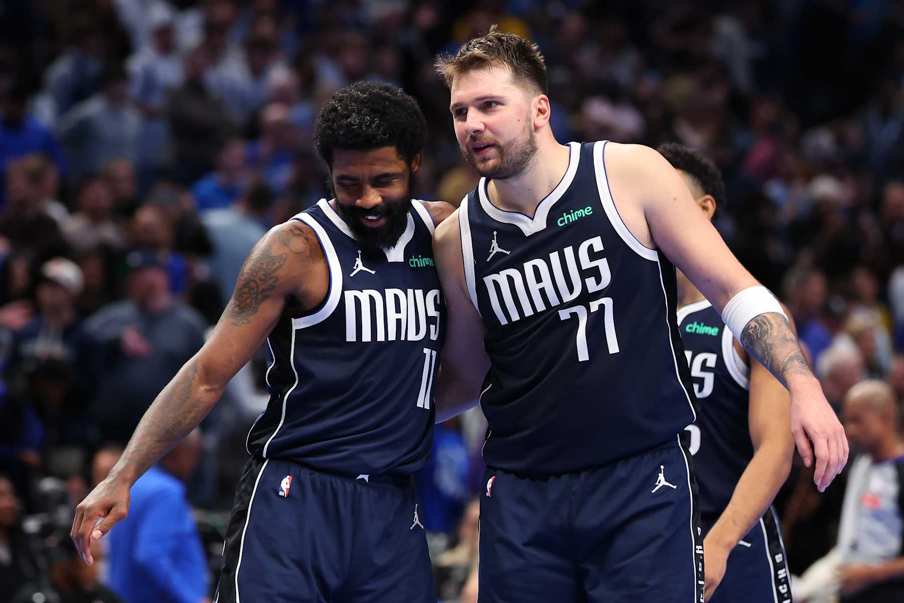 DALLAS, TEXAS - DECEMBER 03: Kyrie Irving #11 and Luka Doncic #77 of the Dallas Mavericks celebrate after scoring during the second half of an Emirates NBA Cup game against the Memphis Grizzlies at American Airlines Center on December 03, 2024 in Dallas, Texas. NOTE TO USER: User expressly acknowledges and agrees that, by downloading and/or using this photograph, user is consenting to the terms and conditions of the Getty Images License Agreement. (Photo by Sam Hodde/Getty Images)