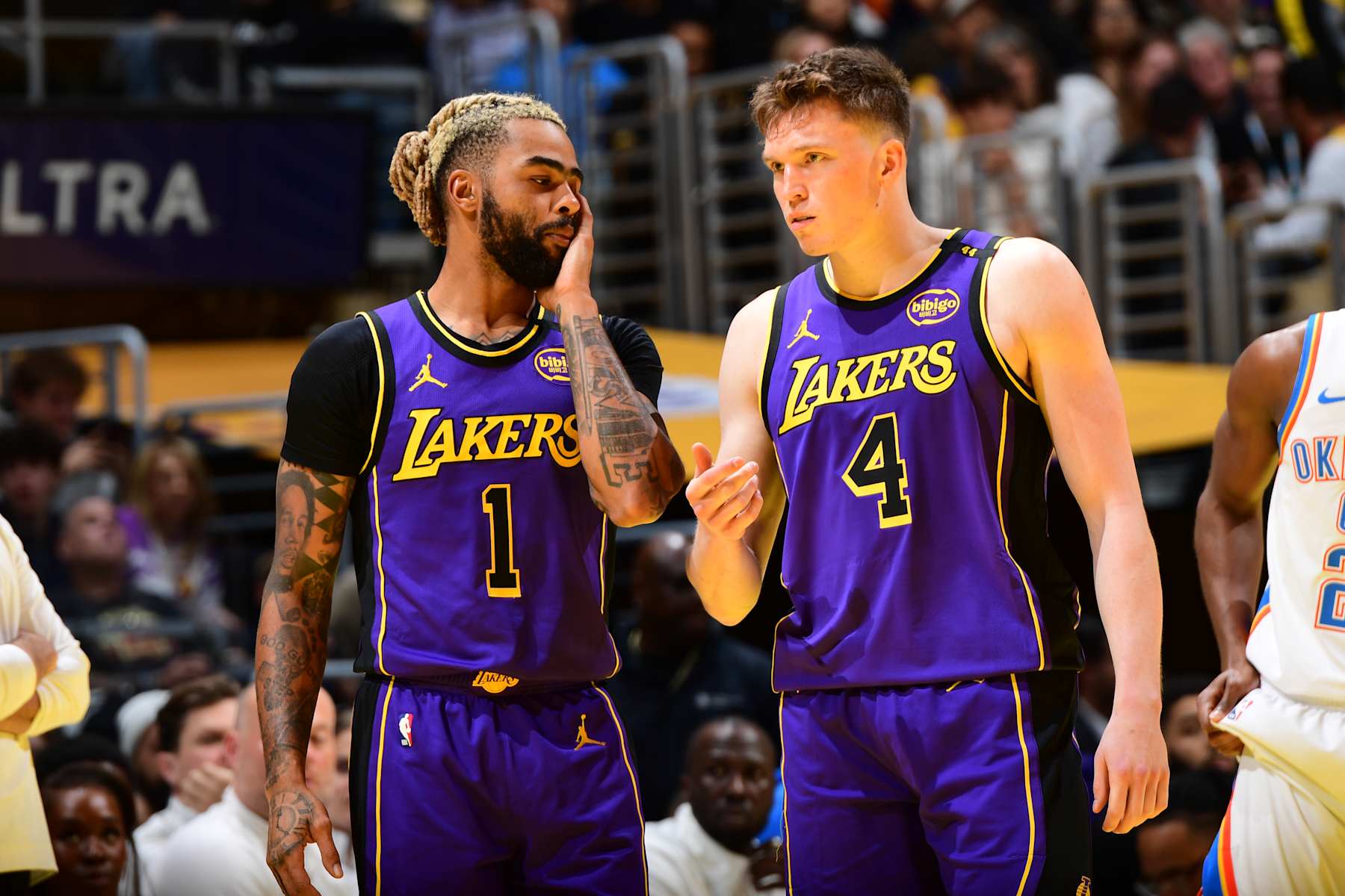 LOS ANGELES, CA - NOVEMBER 29: D'Angelo Russell #1 and Dalton Knecht #4 of the Los Angeles Lakers talk during the game against the Oklahoma City Thunder during a Emirates NBA Cup game on October 22, 2024 at Crypto.Com Arena in Los Angeles, California. NOTE TO USER: User expressly acknowledges and agrees that, by downloading and/or using this Photograph, user is consenting to the terms and conditions of the Getty Images License Agreement. Mandatory Copyright Notice: Copyright 2024 NBAE (Photo by Adam Pantozzi/NBAE via Getty Images)