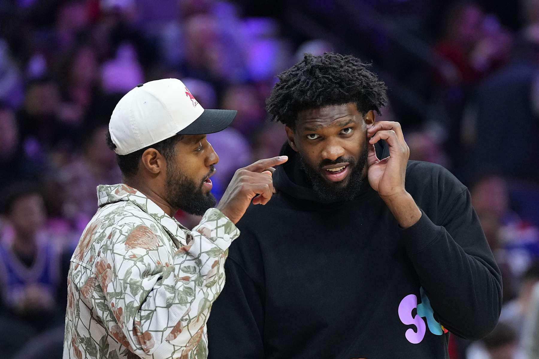 PHILADELPHIA, PENNSYLVANIA - NOVEMBER 2: Paul George #8 of the Philadelphia 76ers talks to Joel Embiid #21 against the Memphis Grizzlies at the Wells Fargo Center on November 2, 2024 in Philadelphia, Pennsylvania. The Grizzlies defeated the 76ers 124-107. NOTE TO USER: User expressly acknowledges and agrees that, by downloading and/or using this photograph, user is consenting to the terms and conditions of the Getty Images License Agreement. (Photo by Mitchell Leff/Getty Images)