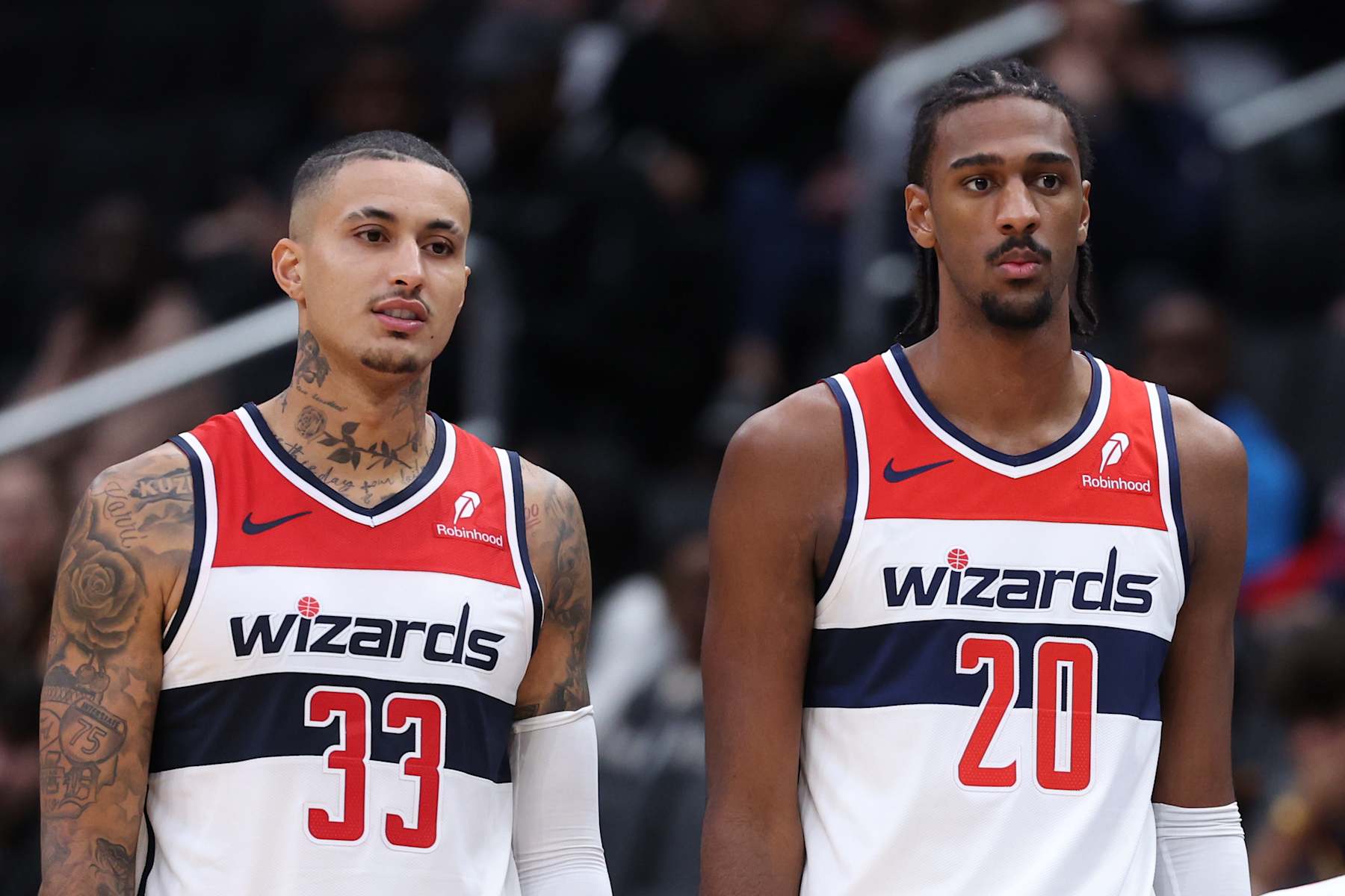 WASHINGTON, DC - OCTOBER 11: Kyle Kuzma #33 and Alex Sarr #20 of the Washington Wizards look on against the Toronto Raptors during the first half of a preseason game at Capital One Arena on October 11, 2024 in Washington, DC. NOTE TO USER: User expressly acknowledges and agrees that, by downloading and or using this photograph, User is consenting to the terms and conditions of the Getty Images License Agreement. (Photo by Patrick Smith/Getty Images)