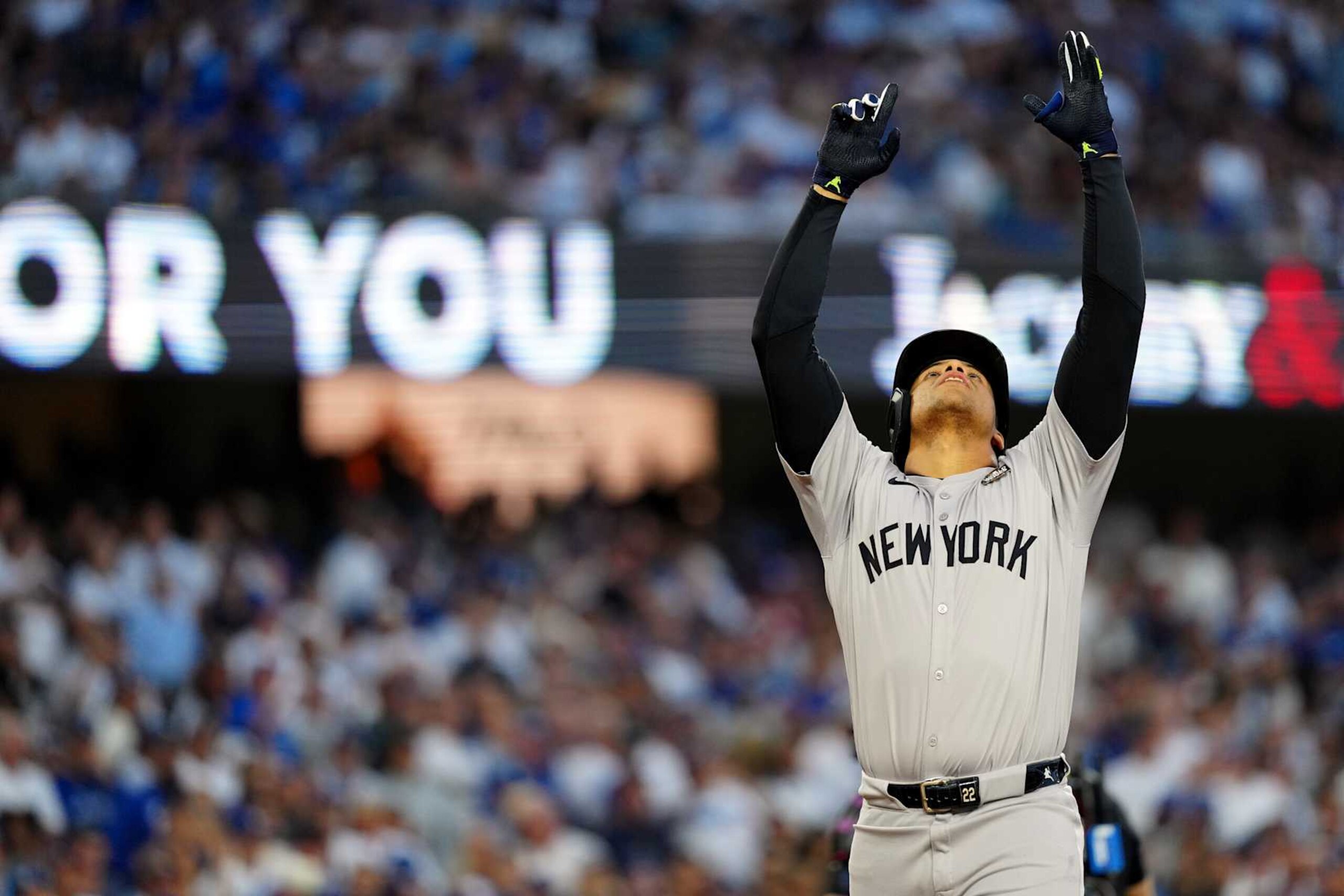 LOS ANGELES, CA - OCTOBER 26:  Juan Soto #22 of the New York Yankees touches home plate and points to the sky after hitting a solo home run in the third inning during Game 2 of the 2024 World Series presented by Capital One between the New York Yankees and the Los Angeles Dodgers at Dodger Stadium on Saturday, October 26, 2024 in Los Angeles, California. (Photo by Daniel Shirey/MLB Photos via Getty Images)