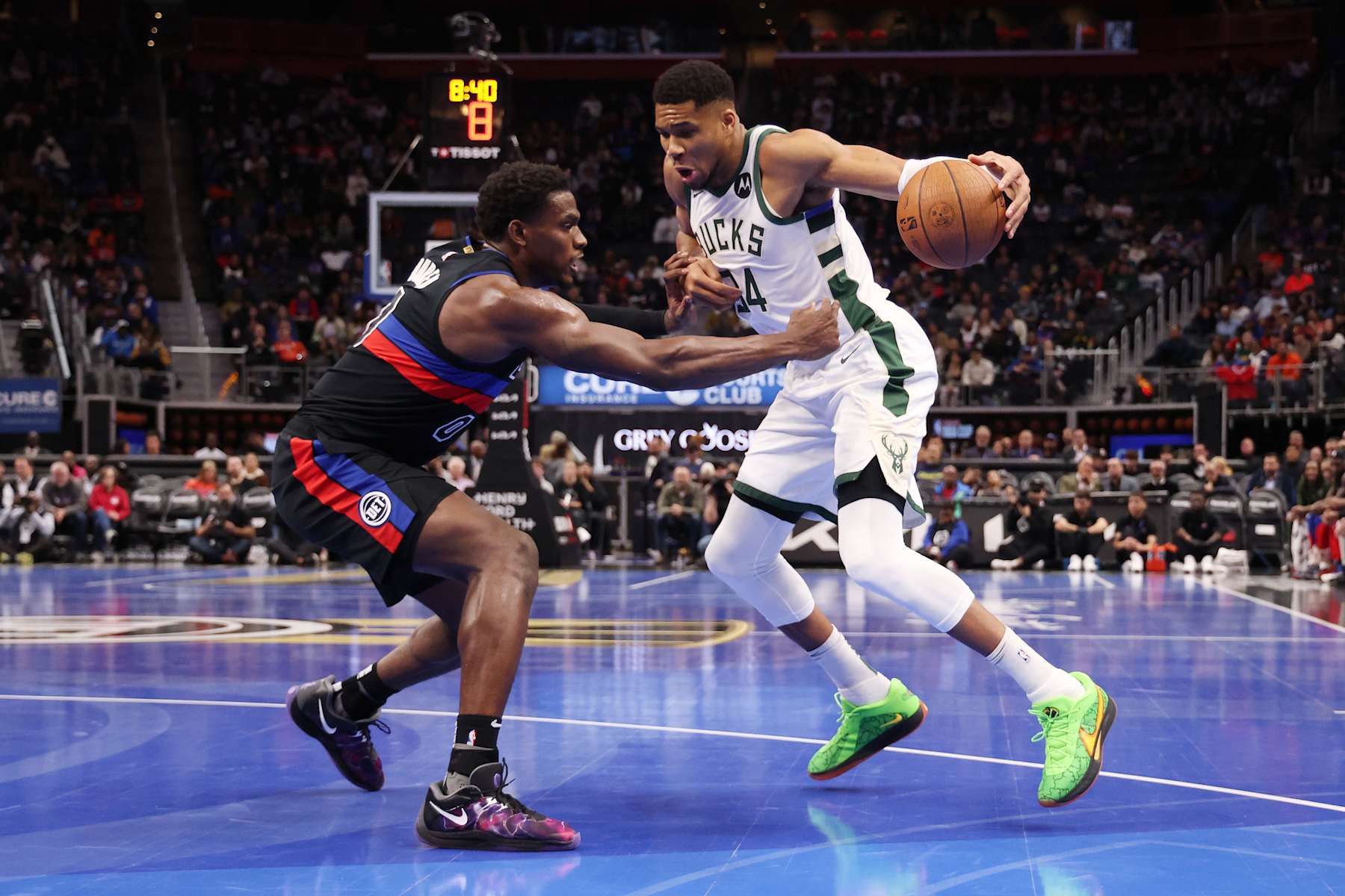 DETROIT, MICHIGAN - DECEMBER 03: Giannis Antetokounmpo #34 of the Milwaukee Bucks drives to the basket against Jalen Duren #0 of the Detroit Pistons during the first half of a NBA Cup game at Little Caesars Arena on December 03, 2024 in Detroit, Michigan. NOTE TO USER: User expressly acknowledges and agrees that, by downloading and or using this photograph, User is consenting to the terms and conditions of the Getty Images License. (Photo by Gregory Shamus/Getty Images)