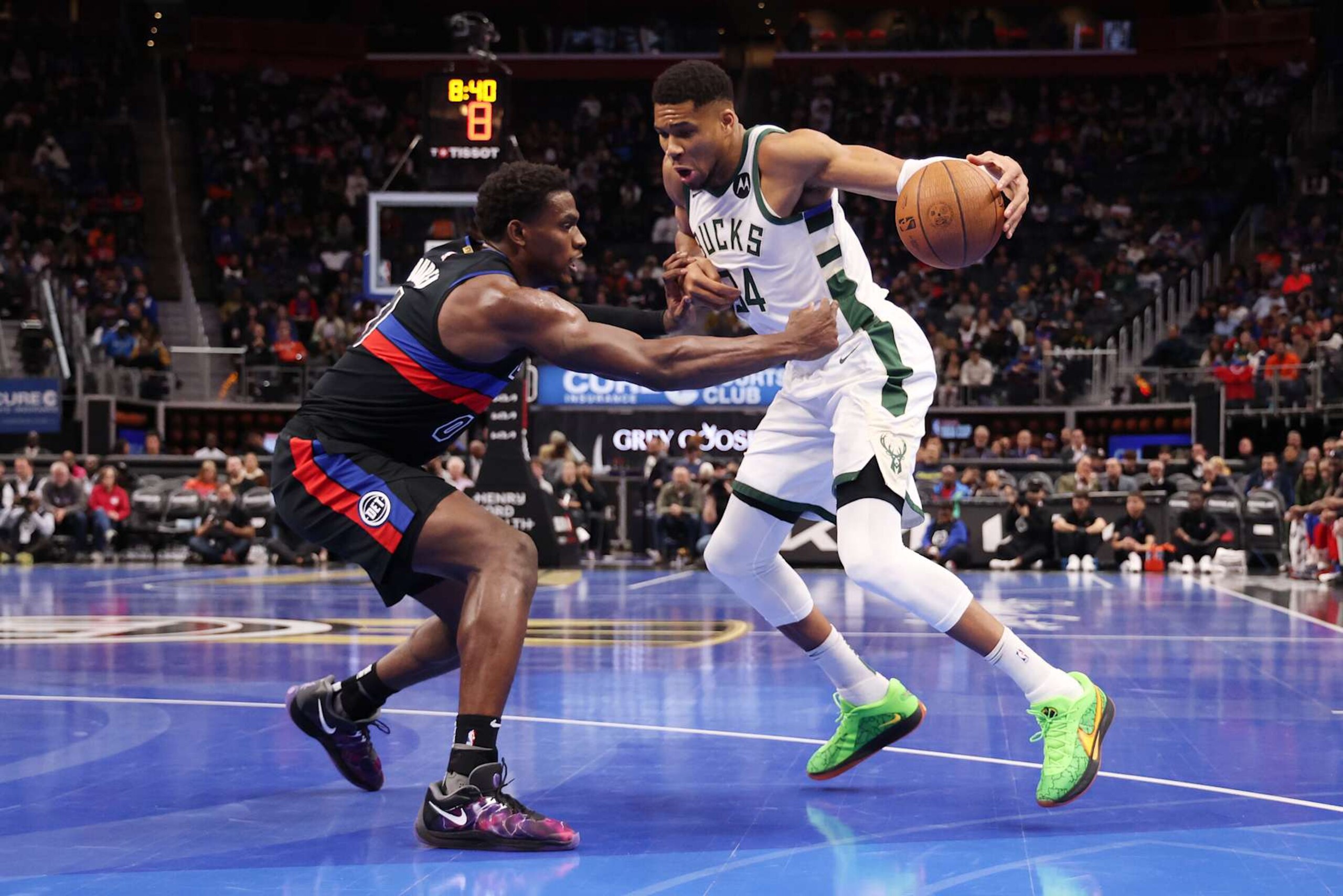 DETROIT, MICHIGAN - DECEMBER 03: Giannis Antetokounmpo #34 of the Milwaukee Bucks drives to the basket against Jalen Duren #0 of the Detroit Pistons during the first half of a NBA Cup game at Little Caesars Arena on December 03, 2024 in Detroit, Michigan. NOTE TO USER: User expressly acknowledges and agrees that, by downloading and or using this photograph, User is consenting to the terms and conditions of the Getty Images License. (Photo by Gregory Shamus/Getty Images)