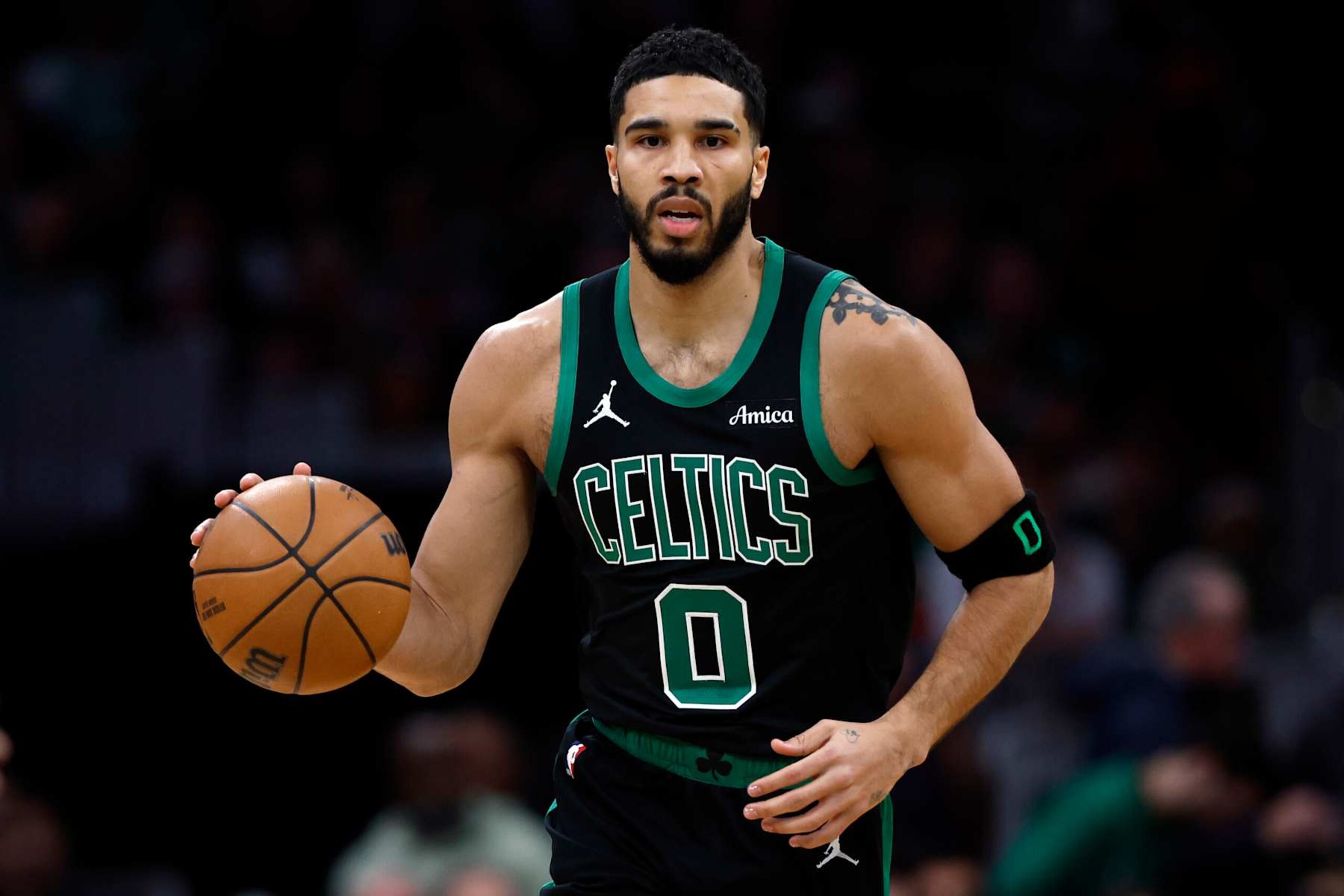 Boston, MA - December 2: Boston Celtics SF Jayson Tatum dribbles in the first quarter. (Photo by Danielle Parhizkaran/The Boston Globe via Getty Images)