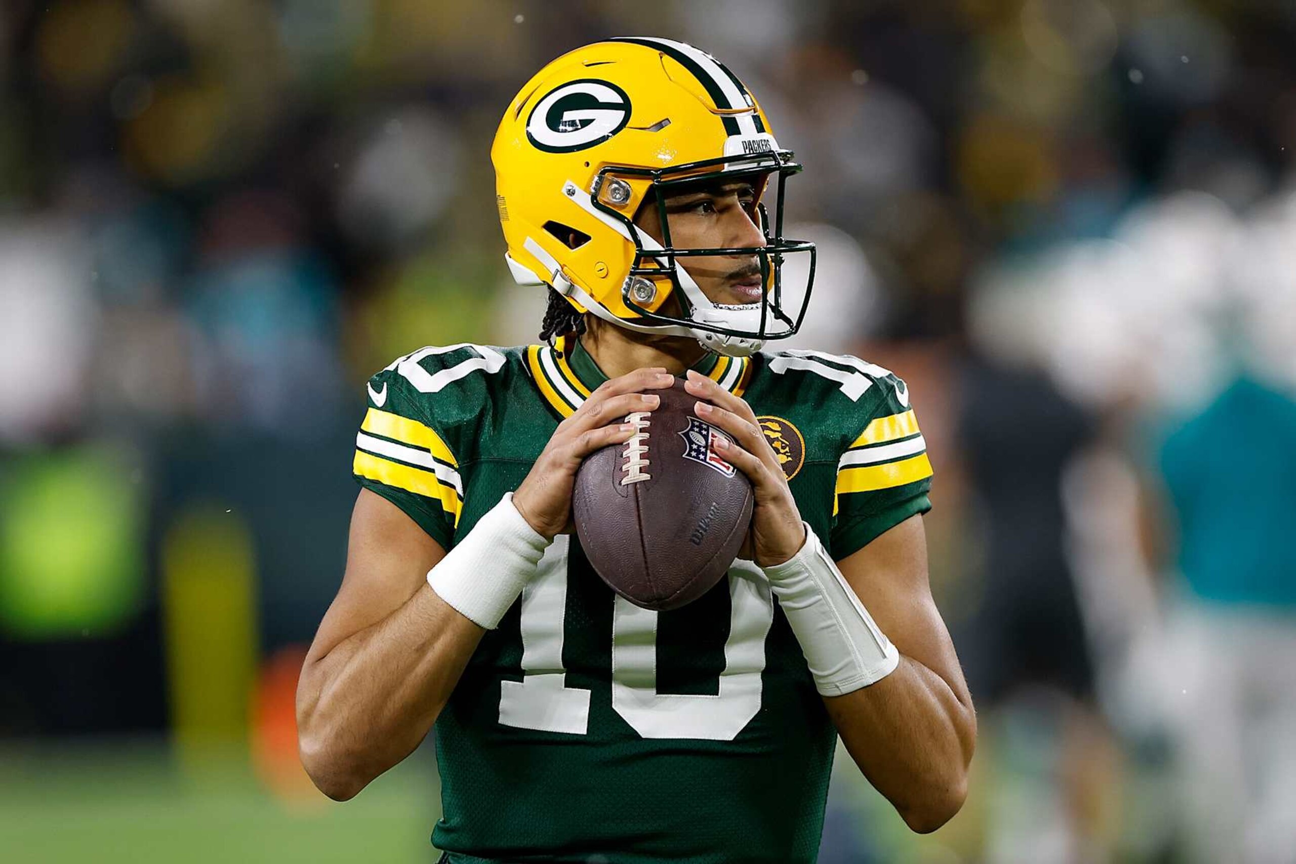 GREEN BAY, WISCONSIN - NOVEMBER 28: Jordan Love #10 of the Green Bay Packers looks on before the game against the Miami Dolphins at Lambeau Field on November 28, 2024 in Green Bay, Wisconsin. (Photo by John Fisher/Getty Images)