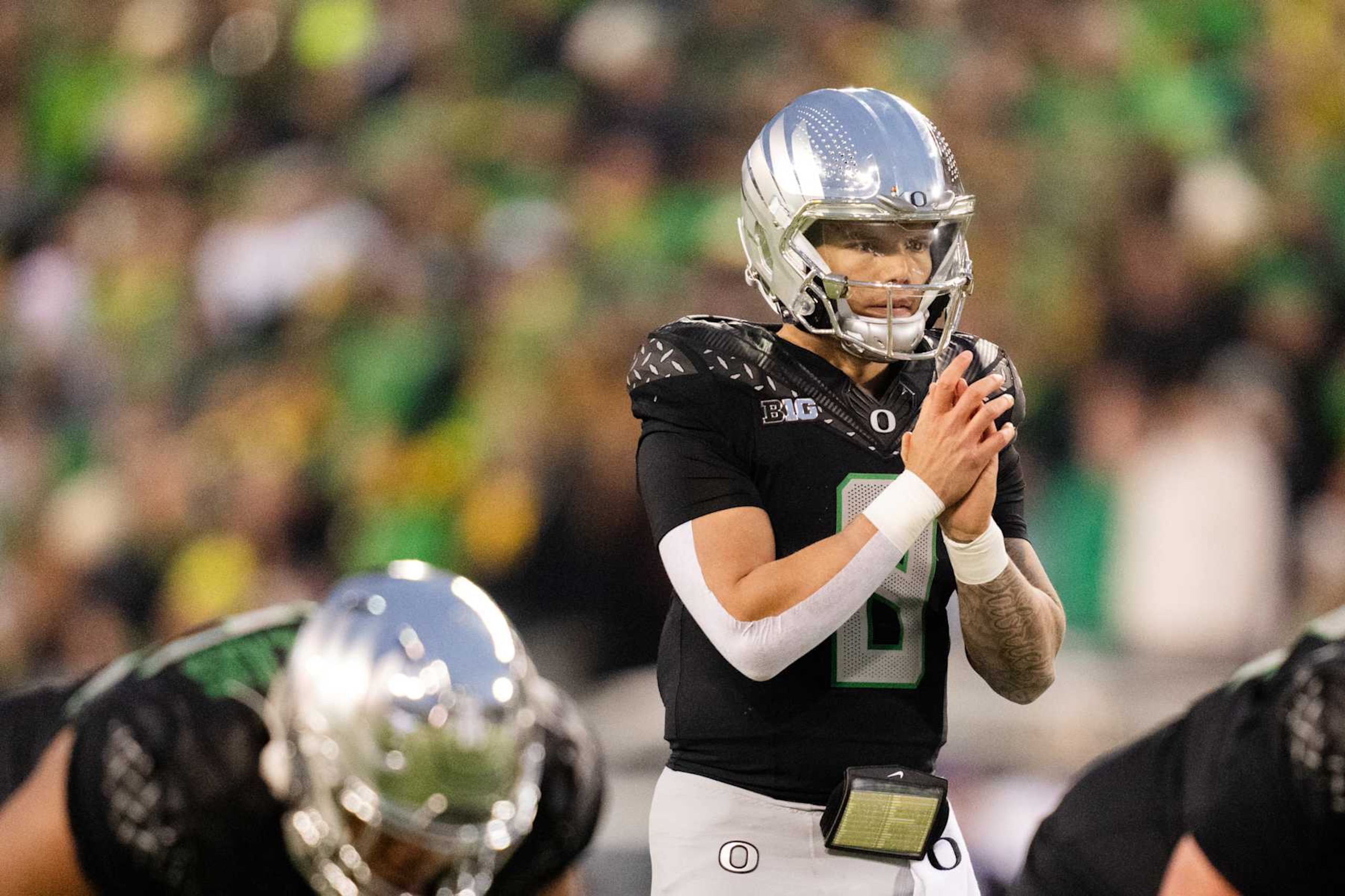 EUGENE, OREGON - NOVEMBER 30:  Quarterback Dillon Gabriel #8 of the Oregon Ducks prepares for a snap during the first half of the game against the Washington Huskies at Autzen Stadium on November 30, 2024 in Eugene, Oregon. (Photo by Ali Gradischer/Getty Images)