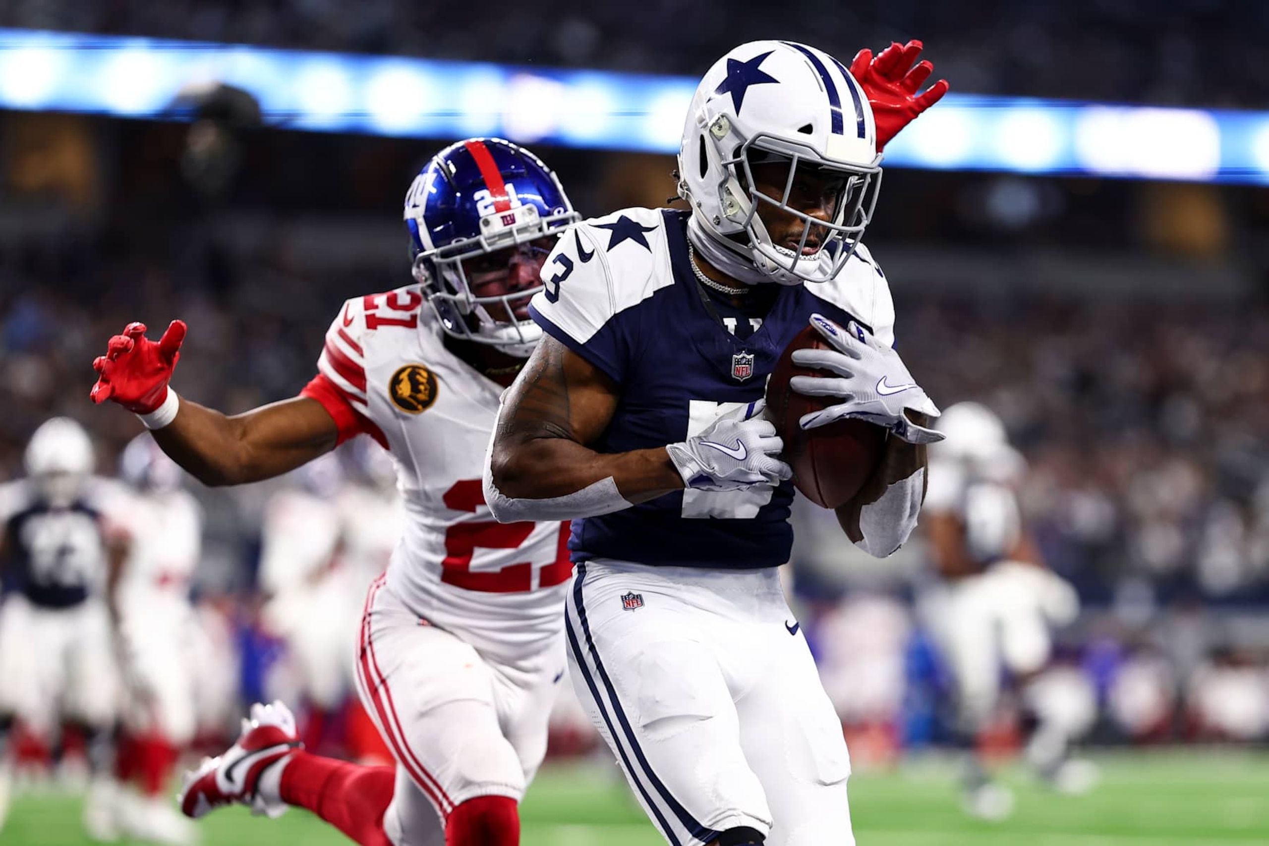 ARLINGTON, TEXAS - NOVEMBER 28: Brandin Cooks #3 of the Dallas Cowboys catches a pass to score a touchdown as Adoree' Jackson #21 of the New York Giants defends during the second half of an NFL football game at AT&T Stadium on November 28, 2024 in Arlington, Texas. (Photo by Kevin Sabitus/Getty Images)