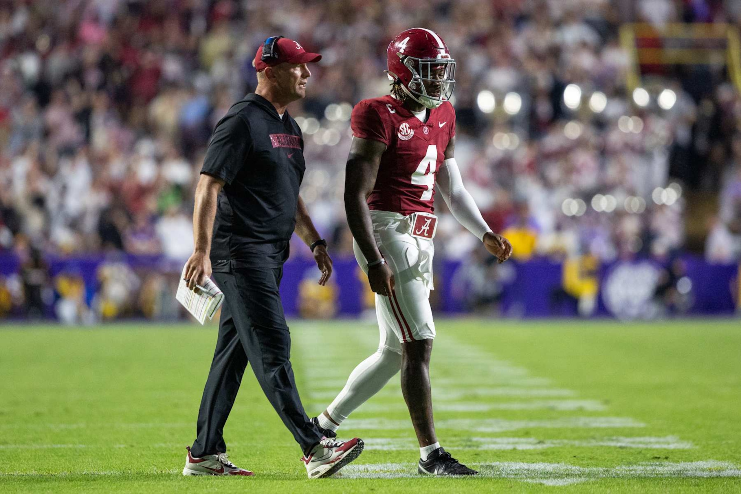 BATON ROUGE, LOUISIANA - NOVEMBER 09: Head coach Kalen DeBoer and Jalen Milroe #4 of the Alabama Crimson Tide after scoring their first touchdown against the LSU Tigers at Tiger Stadium on November 9, 2024 in Baton Rouge, Louisiana. (Photo by Aric Becker/ISI Photos/Getty Images)