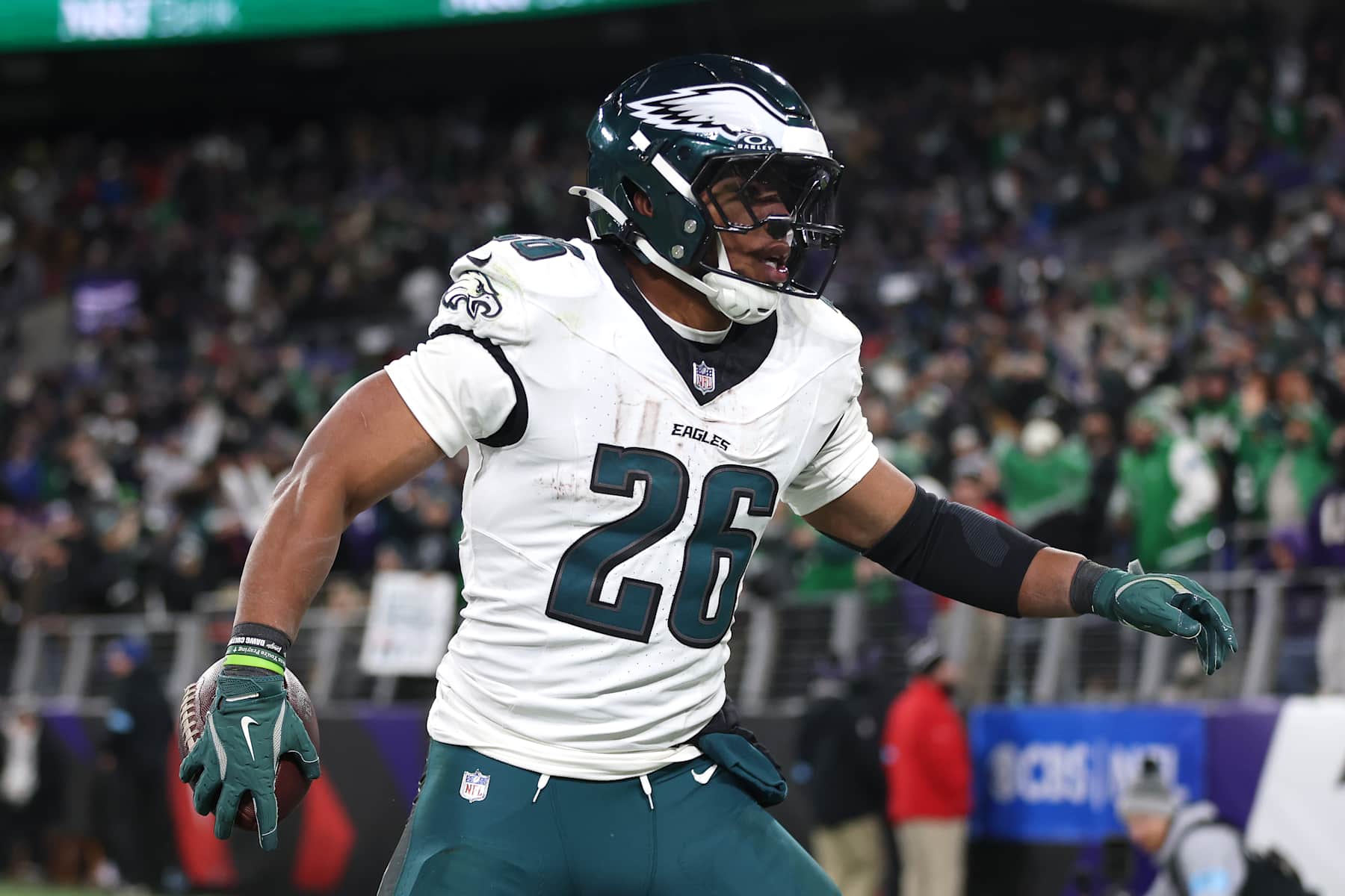 BALTIMORE, MARYLAND - DECEMBER 01: Saquon Barkley #26 of the Philadelphia Eagles reacts after running the ball for a touchdown during the fourth quarter against the Baltimore Ravens at M&T Bank Stadium on December 01, 2024 in Baltimore, Maryland. (Photo by Patrick Smith/Getty Images)