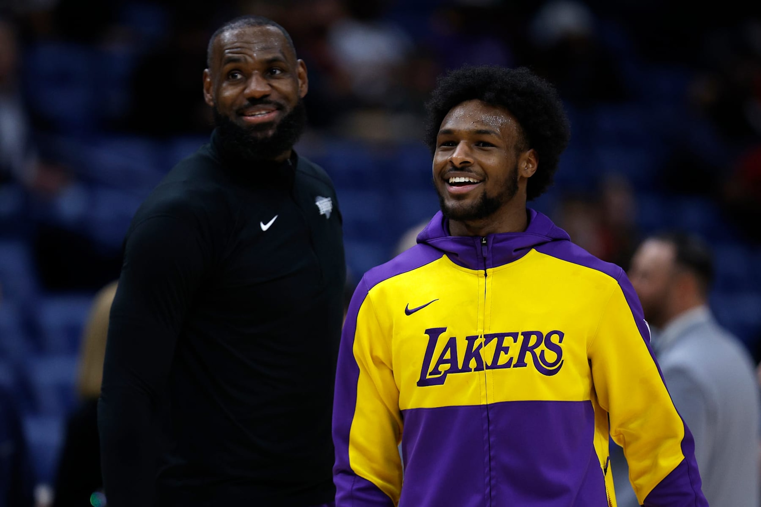 NEW ORLEANS, LOUISIANA - NOVEMBER 16: LeBron James #23 of the Los Angeles Lakers and Bronny James #9 of the Los Angeles Lakers stand on the court prior to the start of an NBA game against the New Orleans Pelicans at Smoothie King Center on November 16, 2024 in New Orleans, Louisiana. NOTE TO USER: User expressly acknowledges and agrees that, by downloading and or using this photograph, User is consenting to the terms and conditions of the Getty Images License Agreement. (Photo by Sean Gardner/Getty Images)