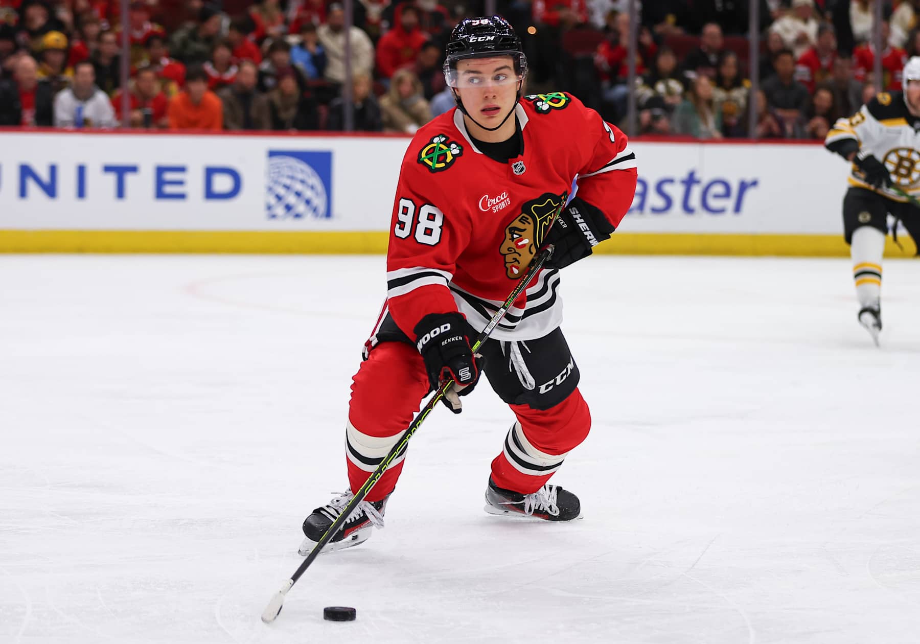 CHICAGO, IL - DECEMBER 04: Connor Bedard #98 of the Chicago Blackhawks controls the puck during the first period against the Boston Bruins on December 4, 2024 at the United Center in Chicago, Illinois. (Photo by Melissa Tamez/Icon Sportswire via Getty Images)