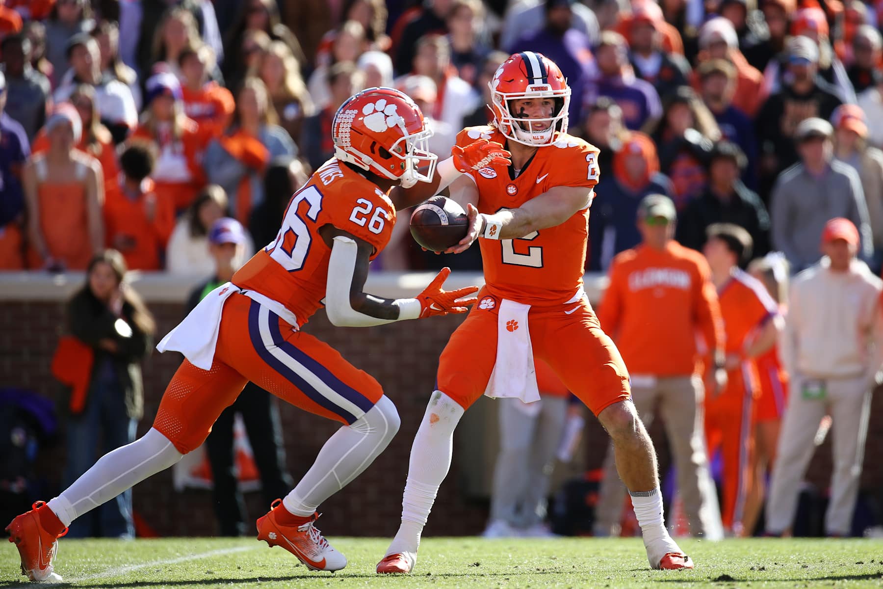 CLEMSON, SOUTH CAROLINA - NOVEMBER 30: Cade Klubnik #2 of the Clemson Tigers hands the ball to Jay Haynes #26 of the Clemson Tigers during the second quarter against the South Carolina Gamecocks at Memorial Stadium on November 30, 2024 in Clemson, South Carolina.  (Photo by Isaiah Vazquez/Getty Images)
