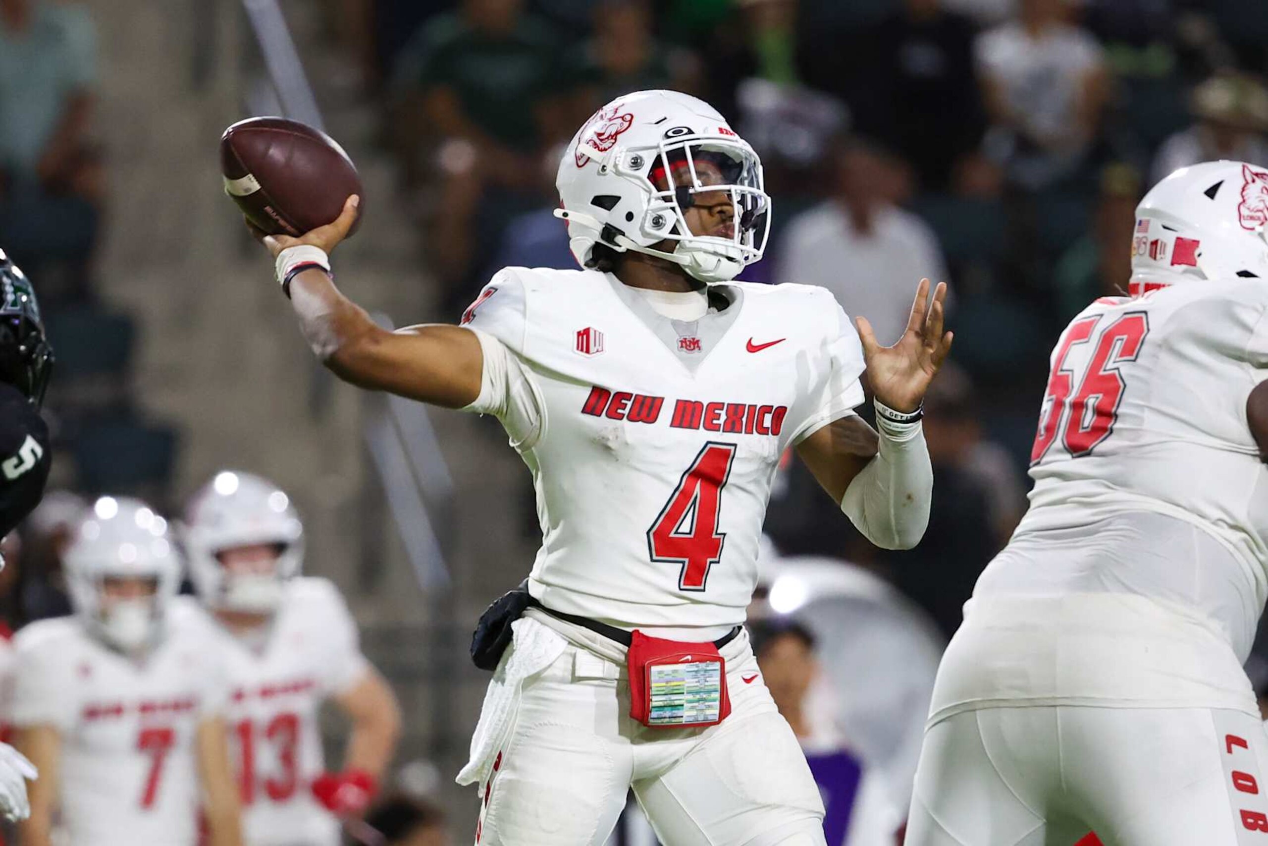 HONOLULU, HAWAII - NOVEMBER 30: Devon Dampier #4 of the New Mexico Lobos fires a pass downfield during the second half against the Hawaii Rainbow Warriors at the Clarence T.C. Ching Athletics Complex on November 30, 2024 in Honolulu, Hawaii.  (Photo by Darryl Oumi/Getty Images)