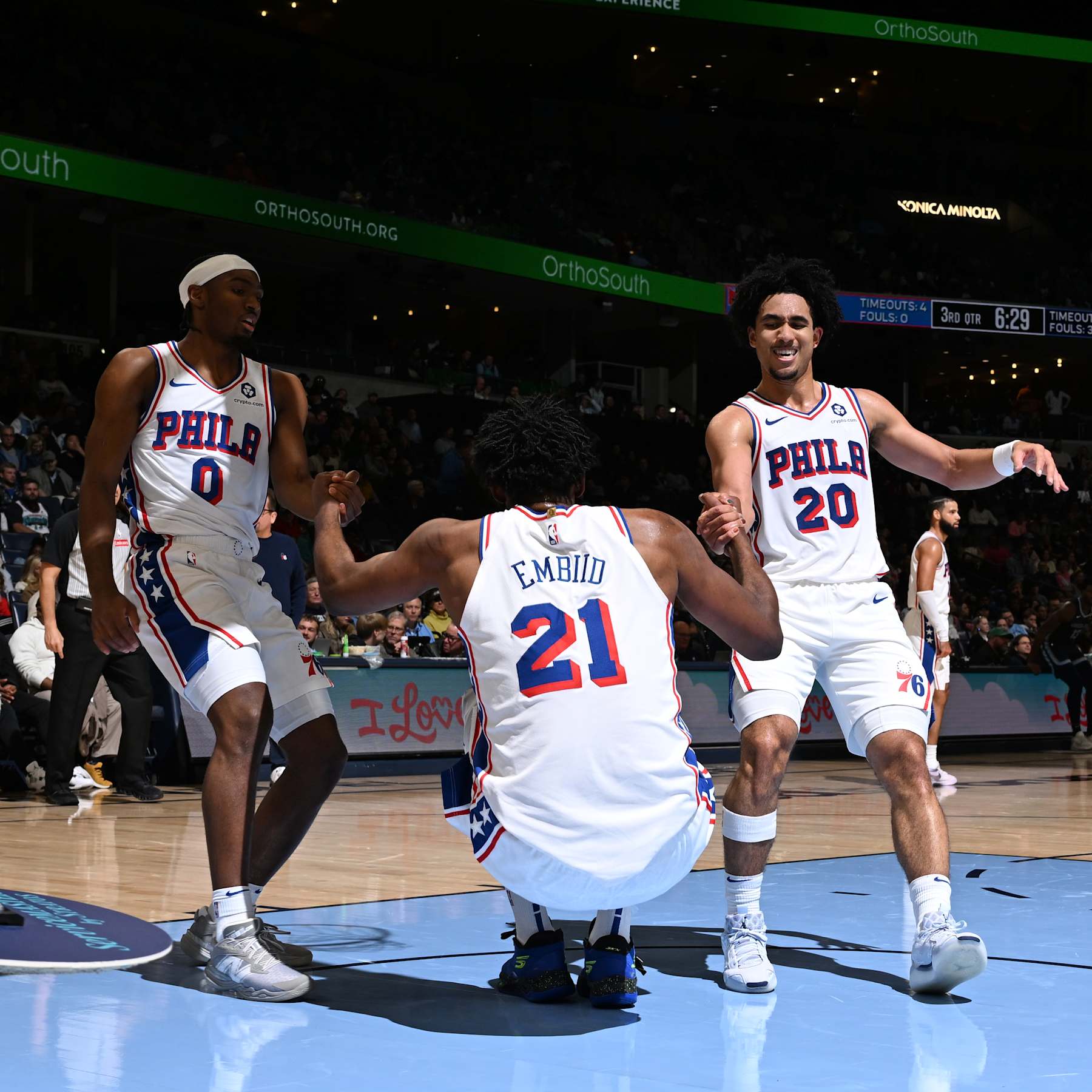 MEMPHIS, TN - NOVEMBER 20: Tyrese Maxey #0 and Jared McCain #20 help up Joel Embiid #21 of the Philadelphia 76ers during the game against the Miami Heat on November 20, 2024 at FedExForum in Memphis, Tennessee. NOTE TO USER: User expressly acknowledges and agrees that, by downloading and or using this photograph, User is consenting to the terms and conditions of the Getty Images License Agreement. Mandatory Copyright Notice: Copyright 2024 NBAE (Photo by Grant Burke/NBAE via Getty Images)
