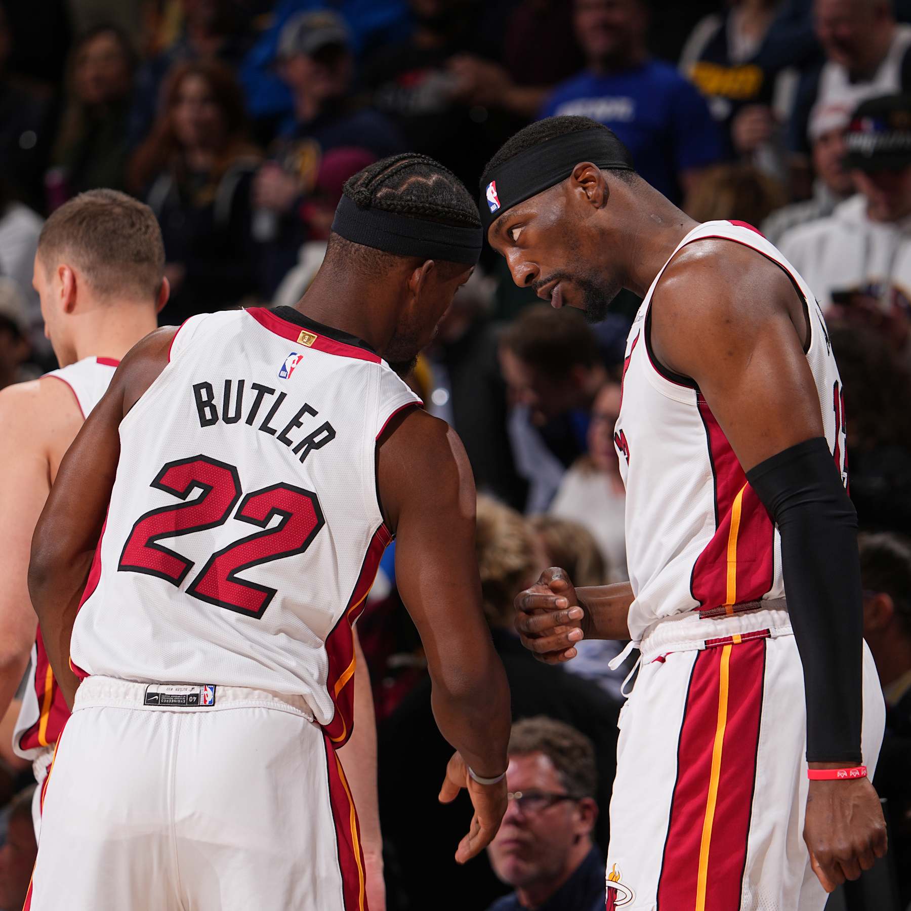 DENVER, CO - FEBRUARY 29: Bam Adebayo #13 talks with Jimmy Butler #22 of the Miami Heat during the game against the Denver Nuggets on February 29, 2024 at the Ball Arena in Denver, Colorado. NOTE TO USER: User expressly acknowledges and agrees that, by downloading and/or using this Photograph, user is consenting to the terms and conditions of the Getty Images License Agreement. Mandatory Copyright Notice: Copyright 2024 NBAE (Photo by Bart Young/NBAE via Getty Images)