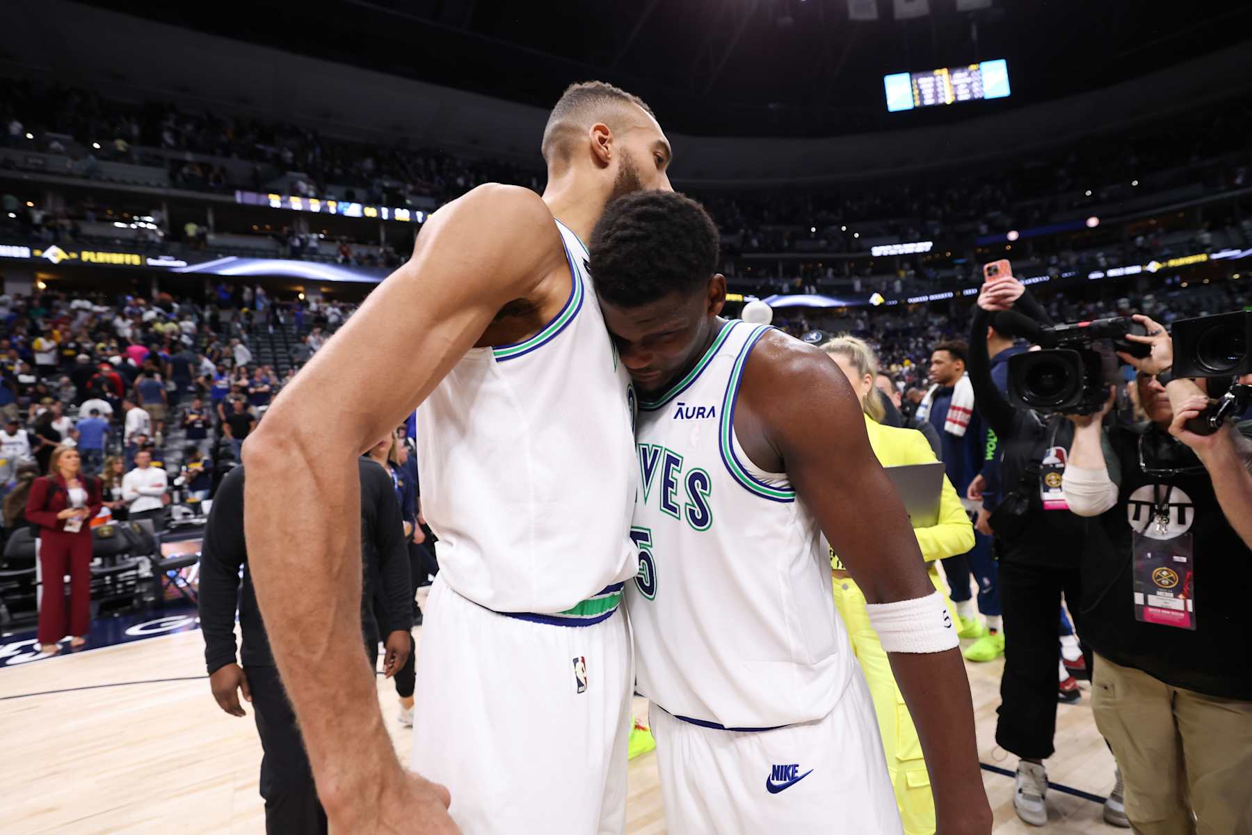 DENVER, CO - MAY 19: Rudy Gobert #27 and Anthony Edwards #5 of the Minnesota Timberwolves celebrates after the game against the Denver Nuggets during Round 2 Game 7 of the 2024 NBA Playoffs on May 19, 2024 at the Ball Arena in Denver, Colorado. NOTE TO USER: User expressly acknowledges and agrees that, by downloading and/or using this Photograph, user is consenting to the terms and conditions of the Getty Images License Agreement. Mandatory Copyright Notice: Copyright 2023 NBAE (Photo by David Sherman/NBAE via Getty Images)