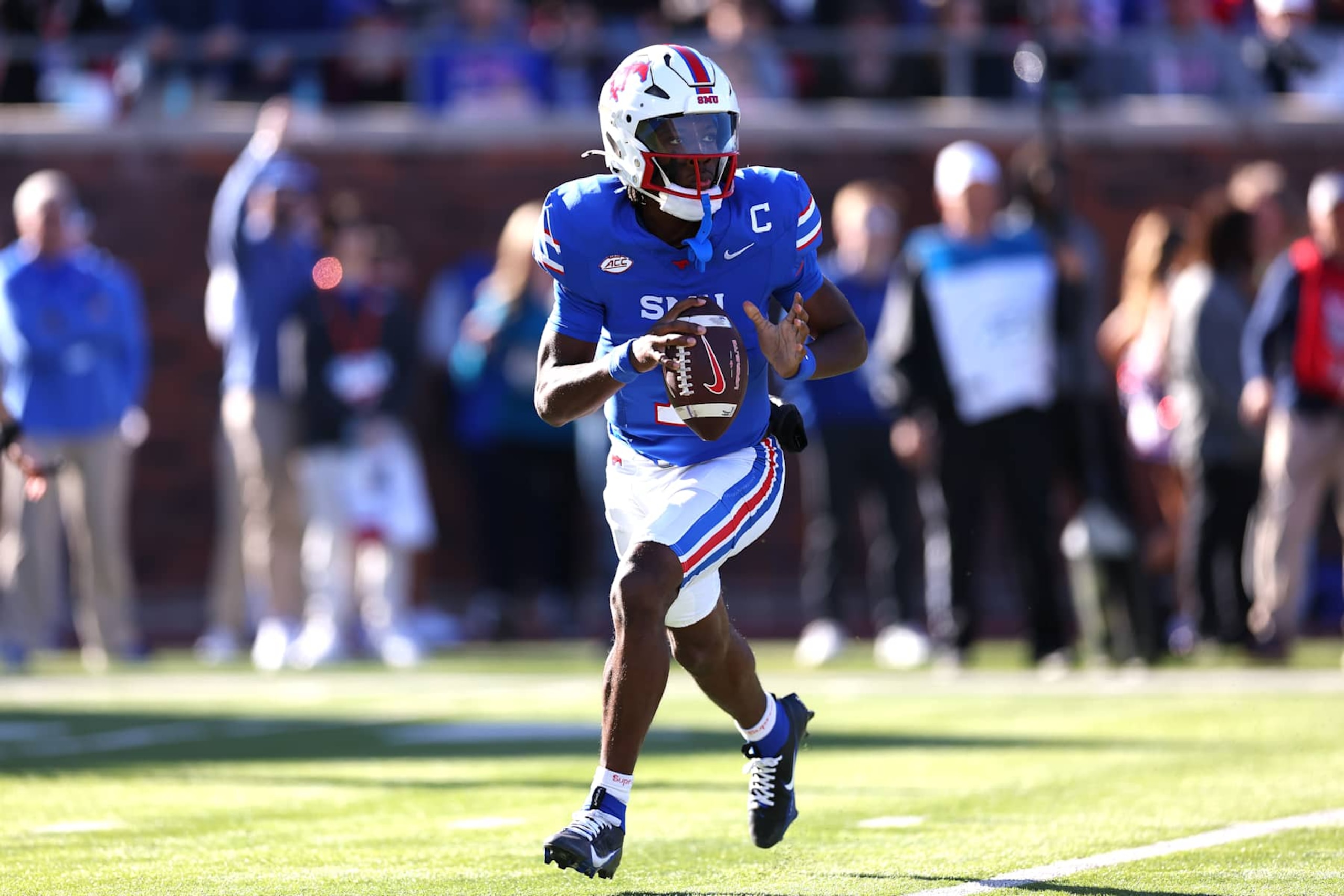 DALLAS, TEXAS - NOVEMBER 30: Kevin Jennings #7 of the Southern Methodist Mustangs looks to pass during the first half against the California Golden Bears at Gerald J. Ford Stadium on November 30, 2024 in Dallas, Texas. (Photo by Sam Hodde/Getty Images)
