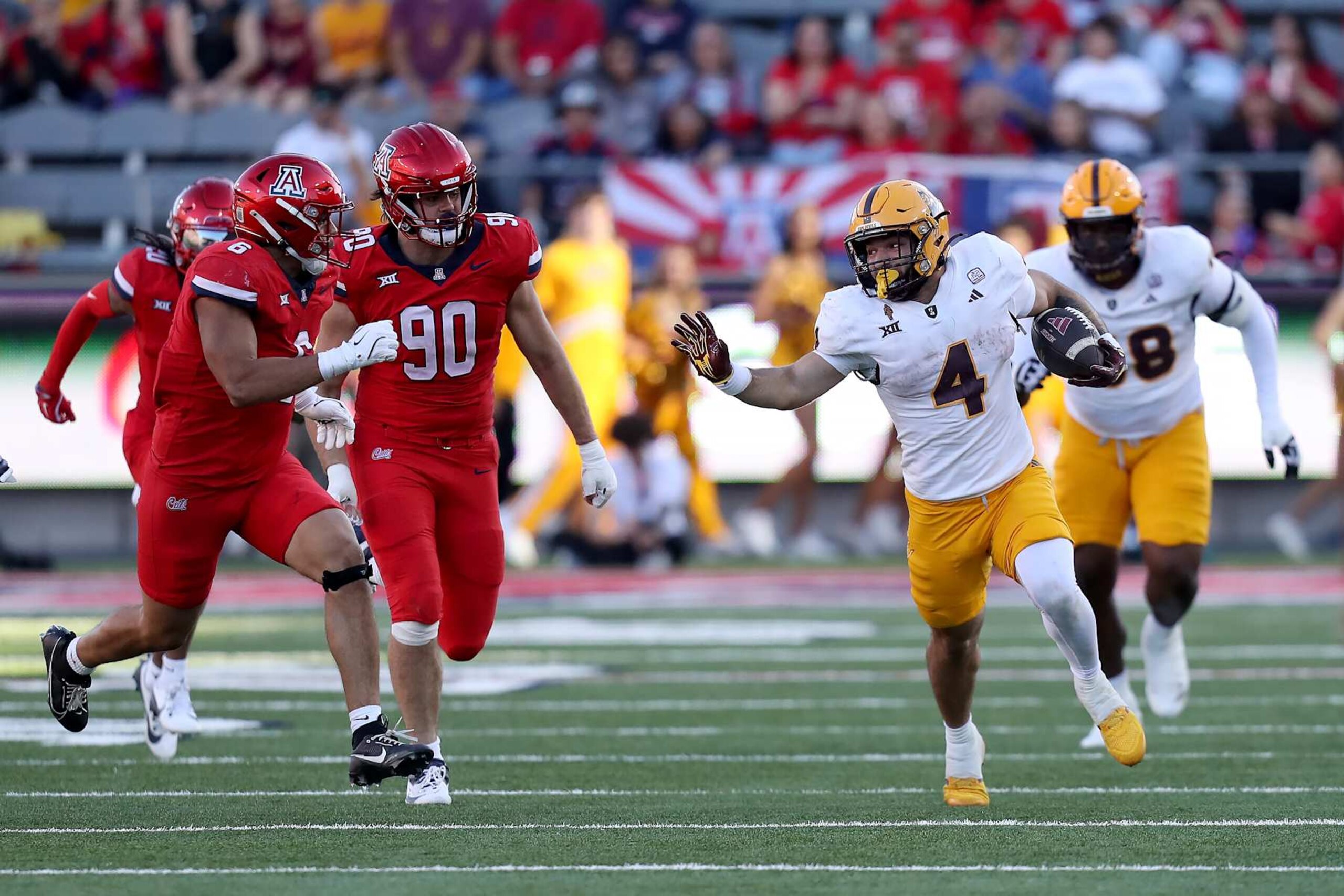 TUCSON, AZ - NOVEMBER 30: Arizona State Sun Devils running back Cam Skattebo #4 during the second half of a football game between the Arizona State University Sun Devils and the University of Arizona Wildcats.  November 30, 2024 at Arizona Stadium in Tucson, AZ. (Photo by Christopher Hook/Icon Sportswire via Getty Images)
