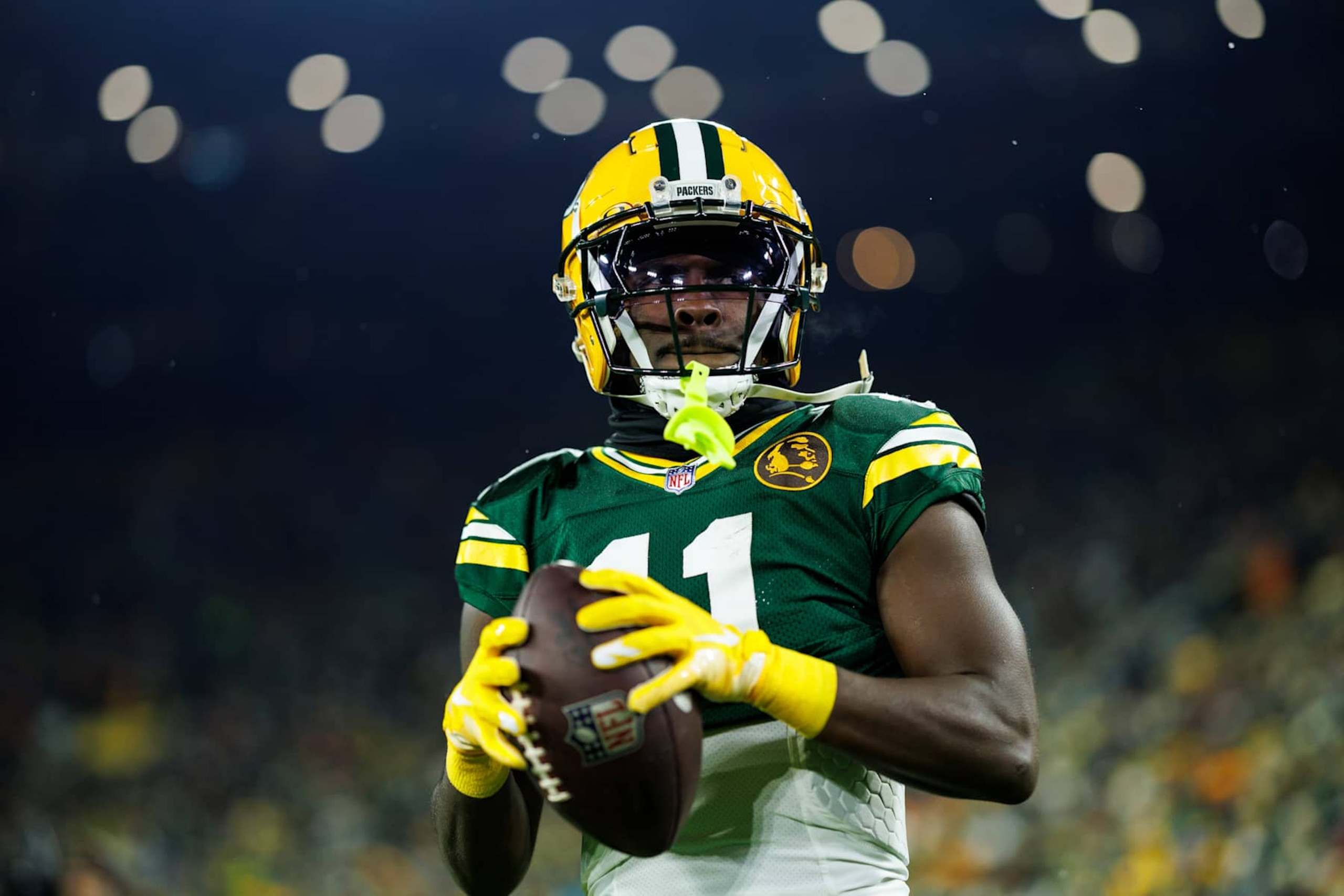 GREEN BAY, WISCONSIN - NOVEMBER 28: Wide receiver Jayden Reed #11 of the Green Bay Packers warms up prior to an NFL game against the Miami Dolphins at Lambeau Field on November 28, 2024 in Green Bay, Wisconsin. (Photo by Brooke Sutton/Getty Images)