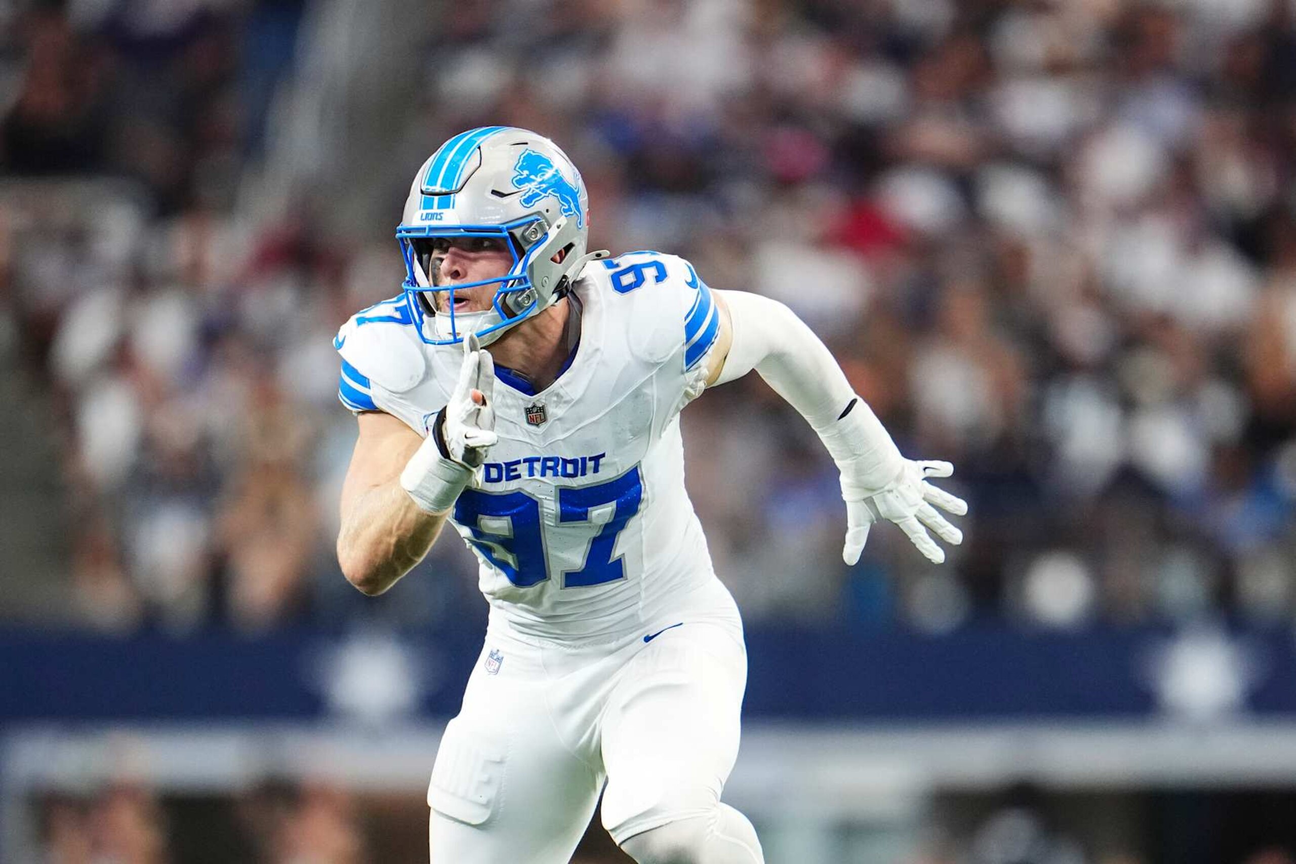 ARLINGTON, TX - OCTOBER 13: Aidan Hutchinson #97 of the Detroit Lions rushes the passer during an NFL football game against the Dallas Cowboys at AT&T Stadium on October 13, 2024 in Arlington, Texas. (Photo by Cooper Neill/Getty Images) ARLINGTON, TX - OCTOBER 13: Aidan Hutchinson #97 of the Detroit Lions rushes the passer during an NFL football game against the Dallas Cowboys at AT&T Stadium on October 13, 2024 in Arlington, Texas. (Photo by Cooper Neill/Getty Images)