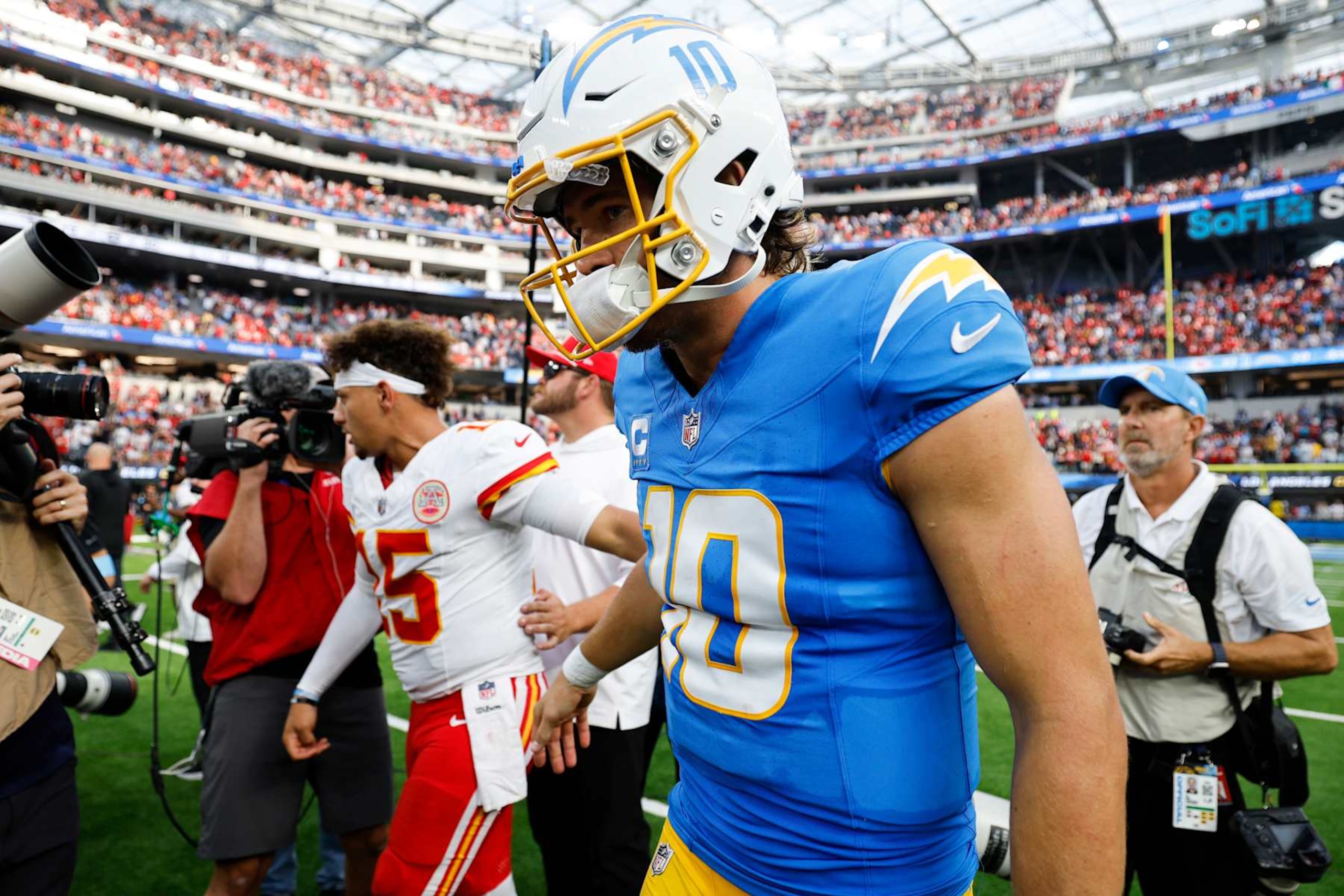 INGLEWOOD, CALIFORNIA - SEPTEMBER 29: Patrick Mahomes #15 of the Kansas City Chiefs and Justin Herbert #10 of the Los Angeles Chargers shake hands following the game at SoFi Stadium on September 29, 2024 in Inglewood, California. (Photo by Kevork Djansezian/Getty Images)